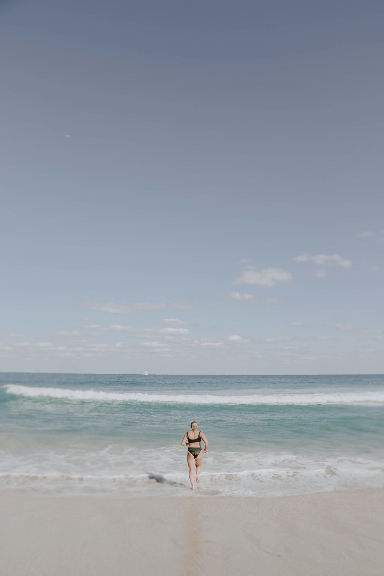 woman on seashore during daytime