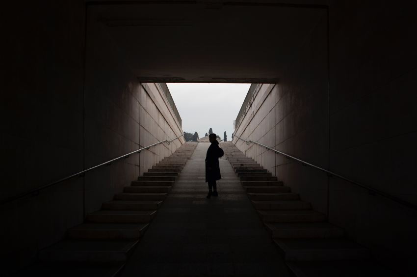 standing person on concrete stairs