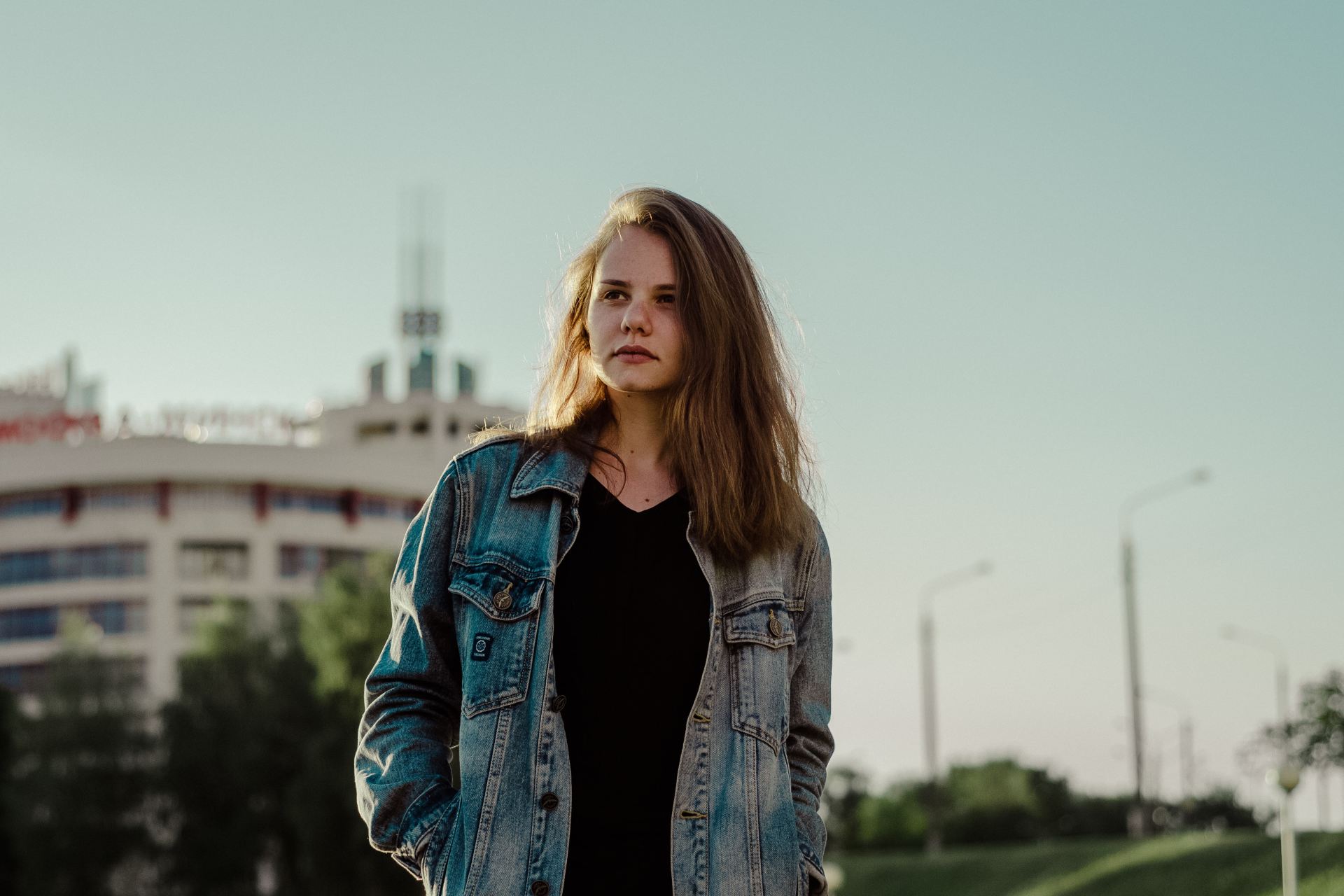 selective focus photography of woman wearing denim jacket