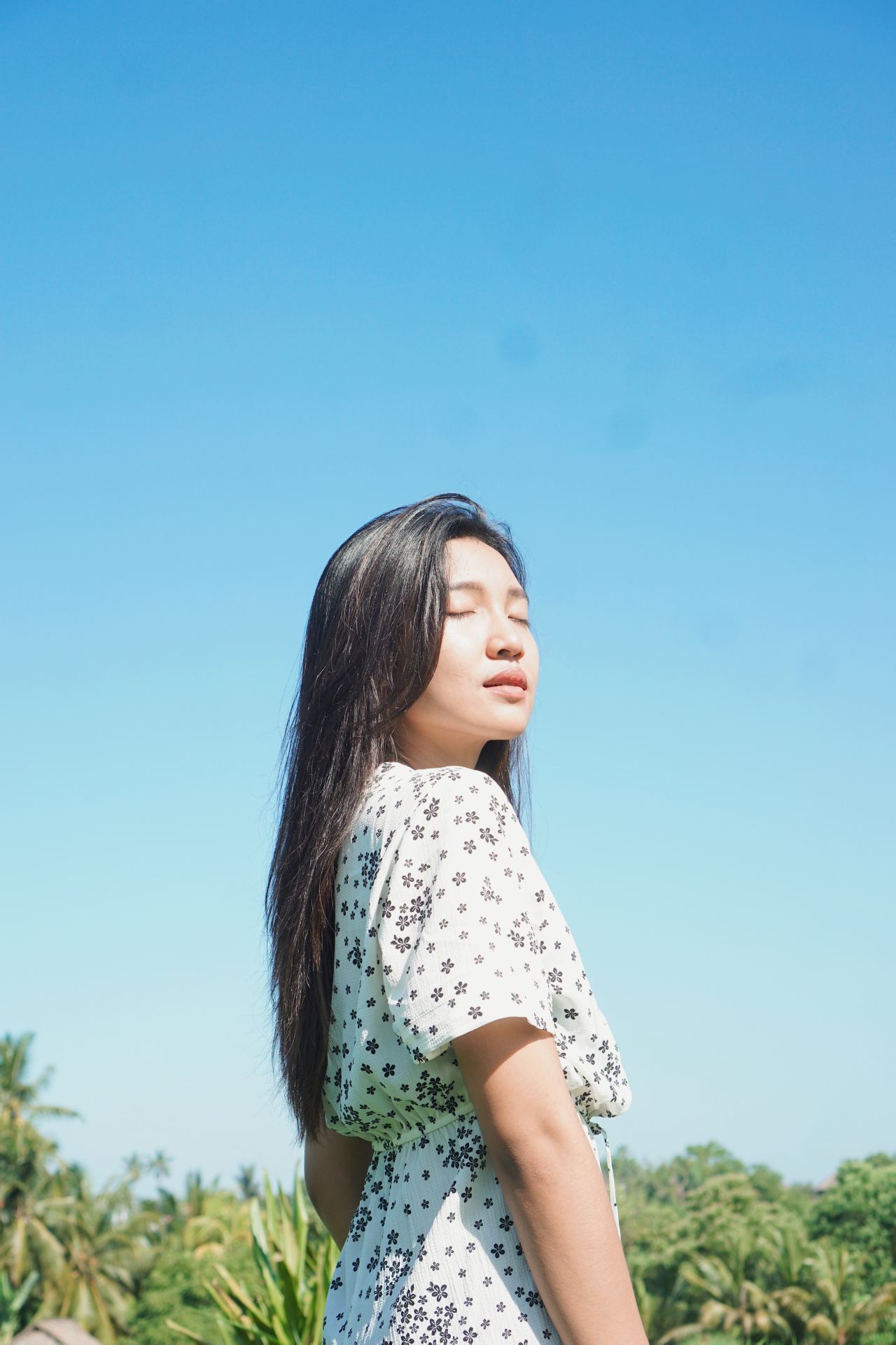 woman in white and black polka dot shirt