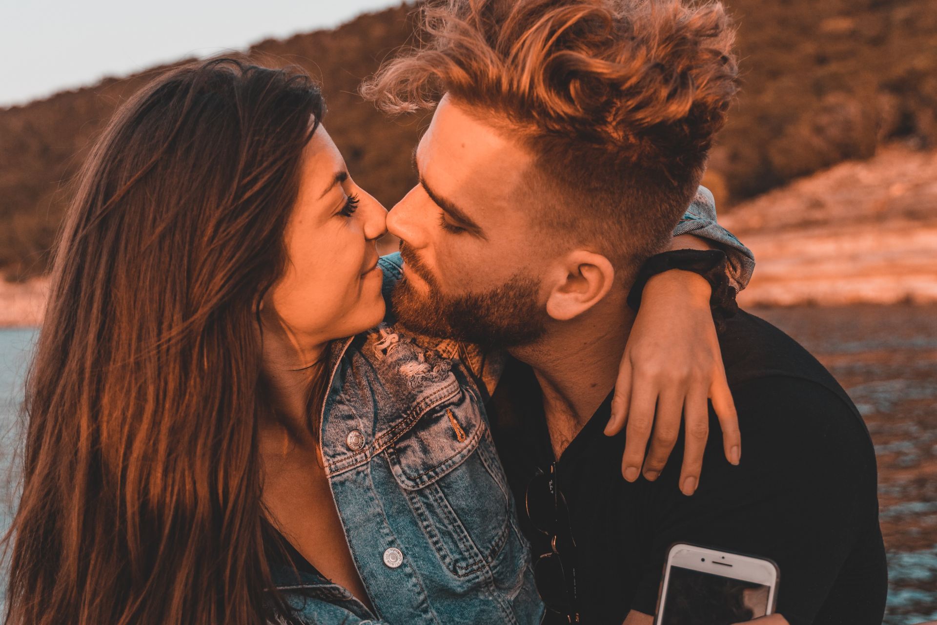 man kissing womans cheek