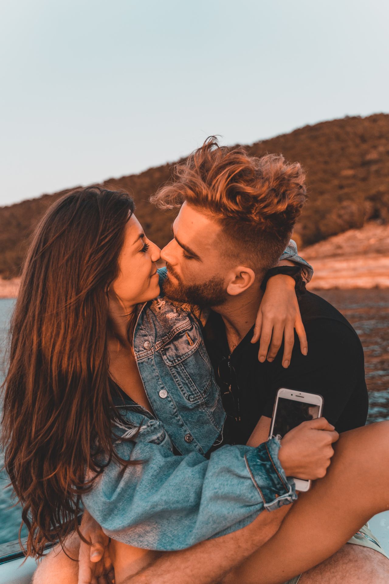 man kissing womans cheek