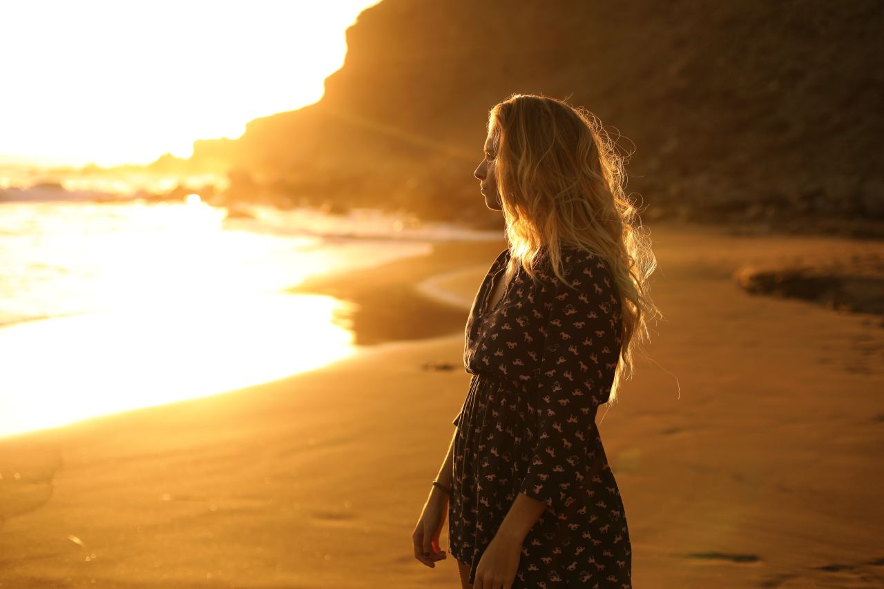 woman standing near body of water