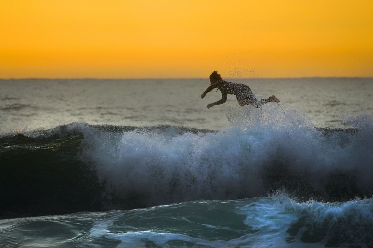 surfer crash on body of water