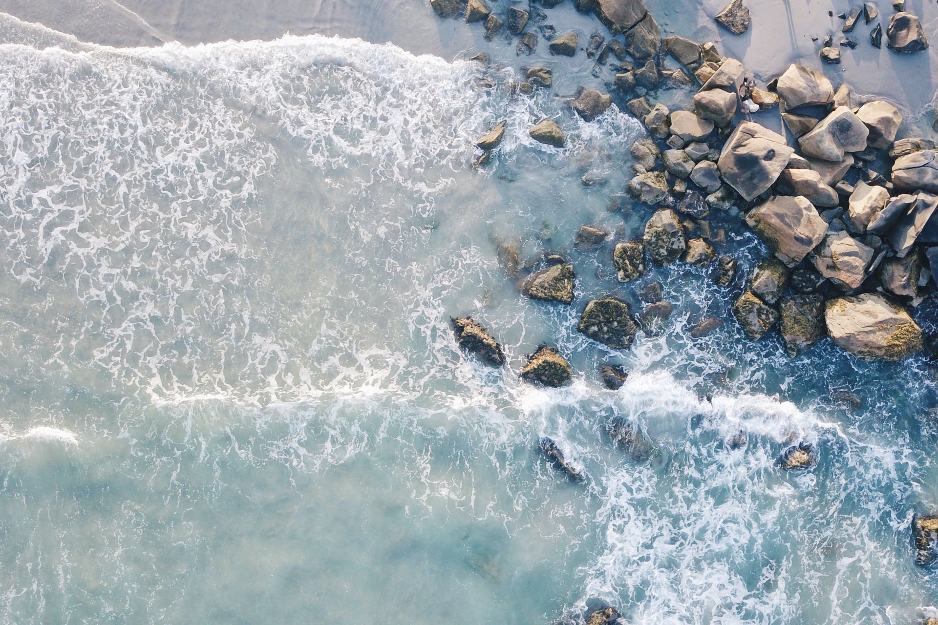 aerial photography of beach with stones