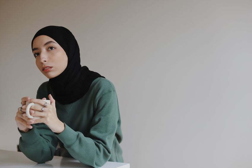 woman in blue hijab and green long sleeve shirt