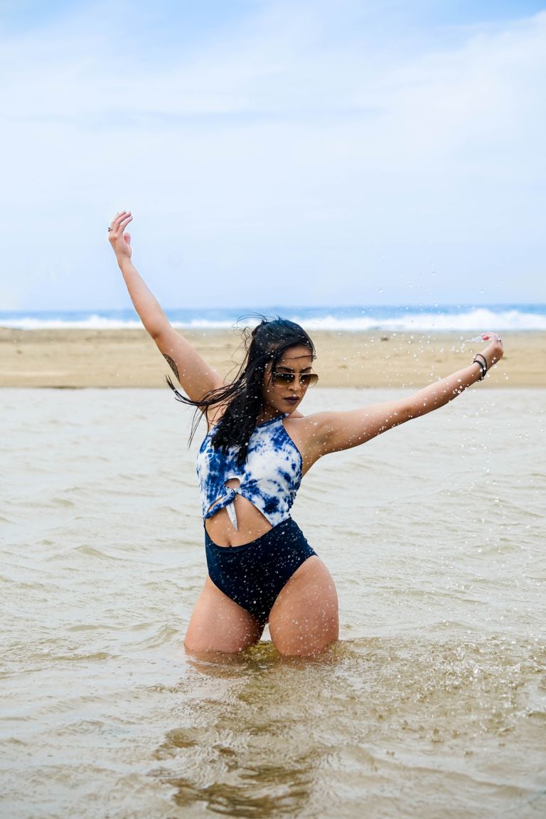 woman standing on body of water