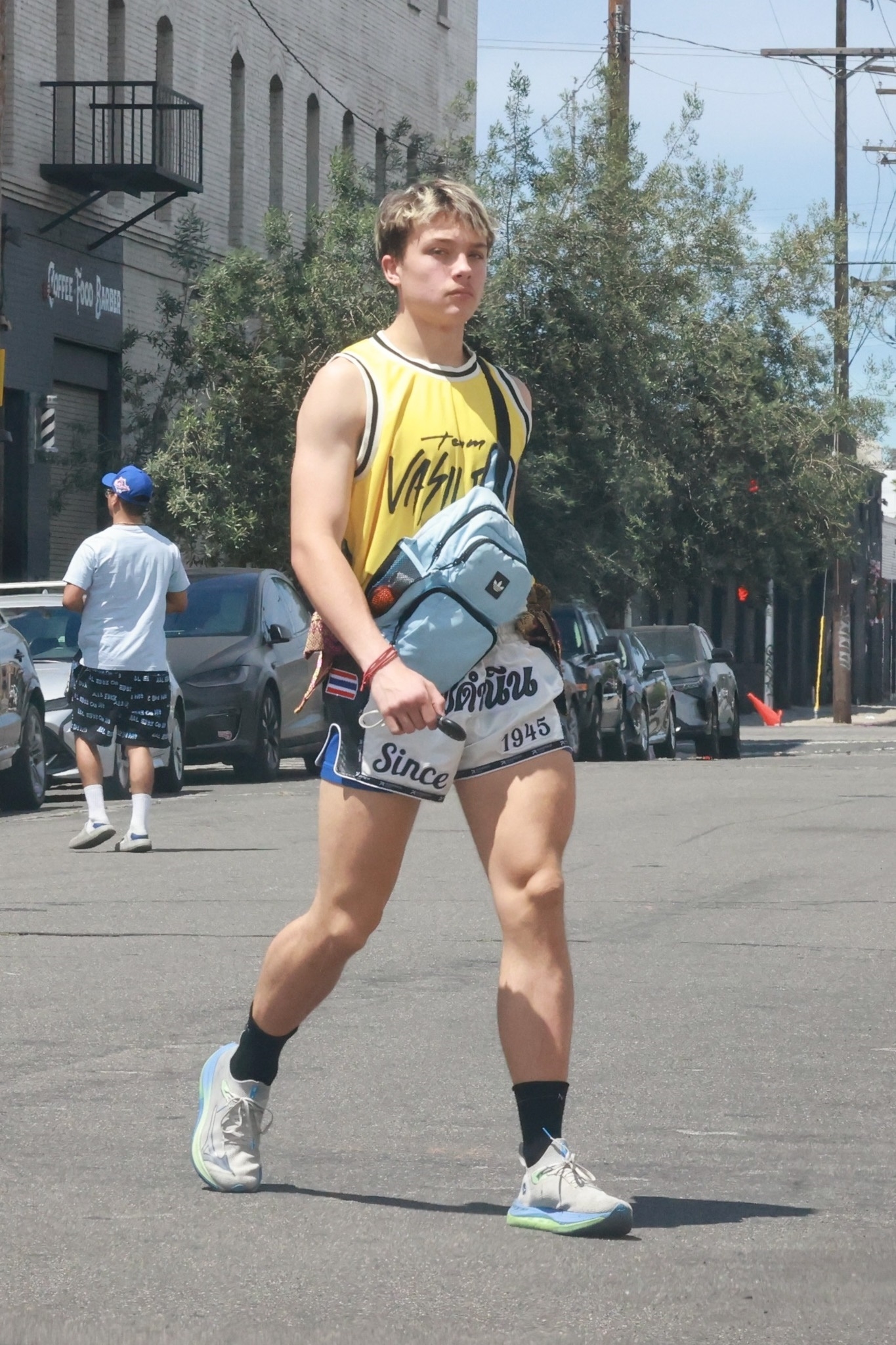 Knox Leon Jolie-Pitt wearing a Team Vasileus shirt and boxing shorts leaving a Muay Thai training session in Los Angeles.