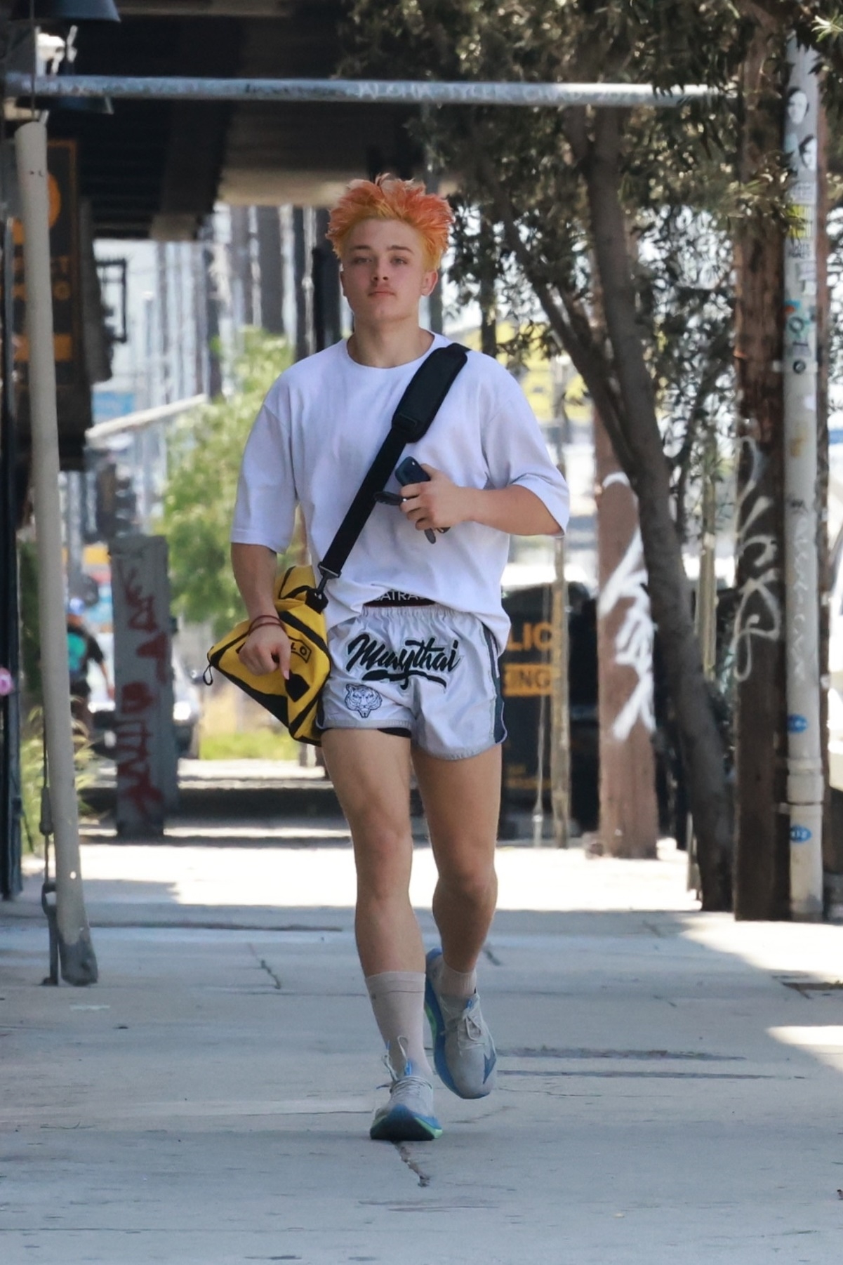 Knox Jolie-Pitt running to his car after Muay Thai class in Los Angeles