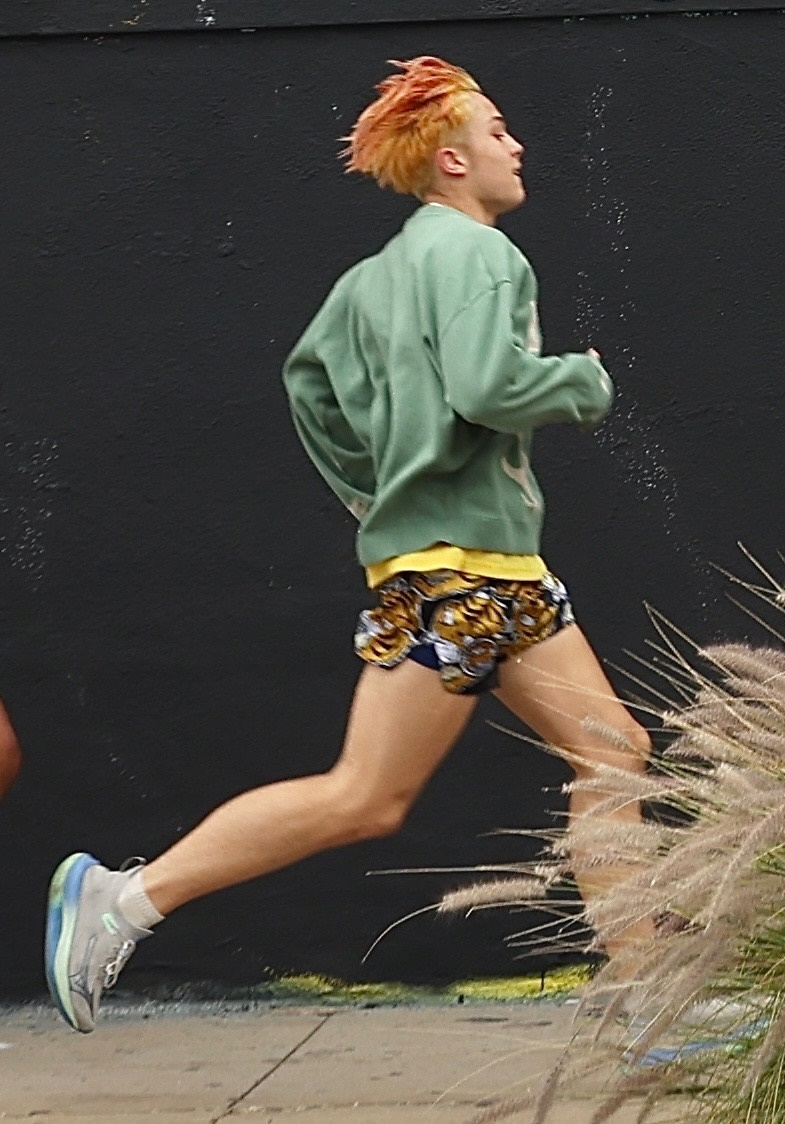 Click to open the image gallery Knox Jolie-Pitt sprinting through the streets of Los Angeles during an outdoor workout session with a trainer