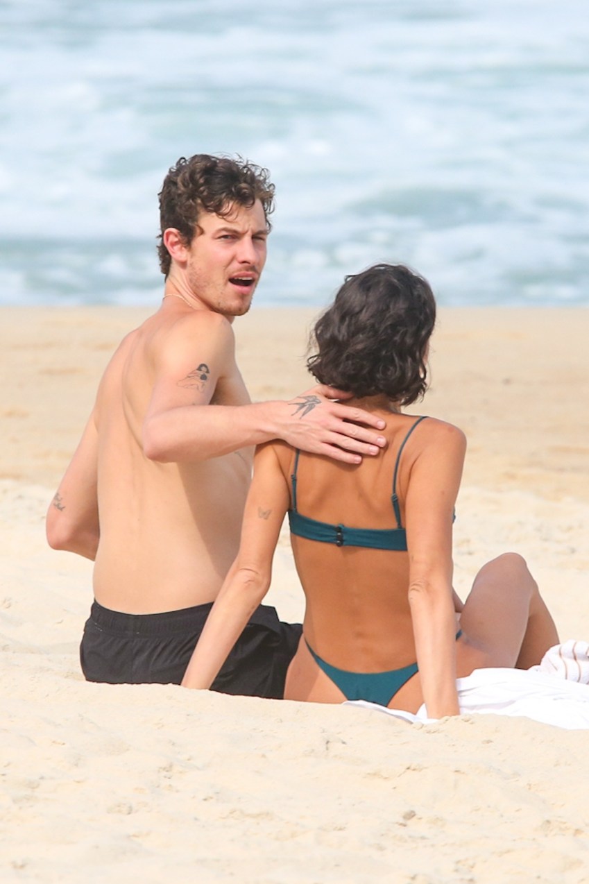 Shawn Mendes and Bruna Marquezine together on a beach in São Conrado, showing PDA in swimwear