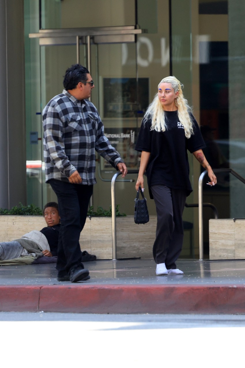 Amanda Bynes with blue eyebrows and a gold bottom grill out with boyfriend Zachary in Los Angeles