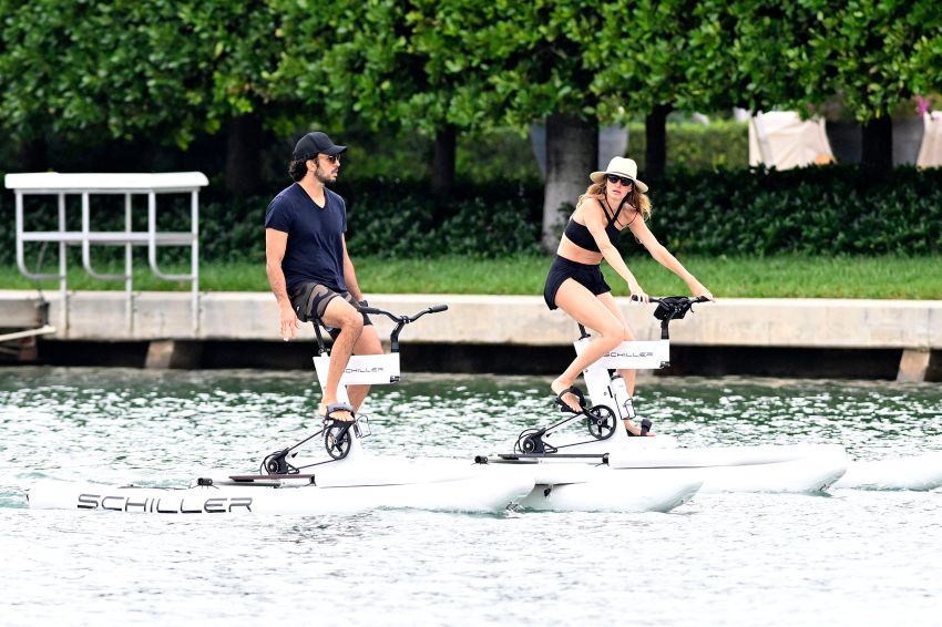 Gisele Bündchen and Joaquim Valente riding water bikes in Miami
