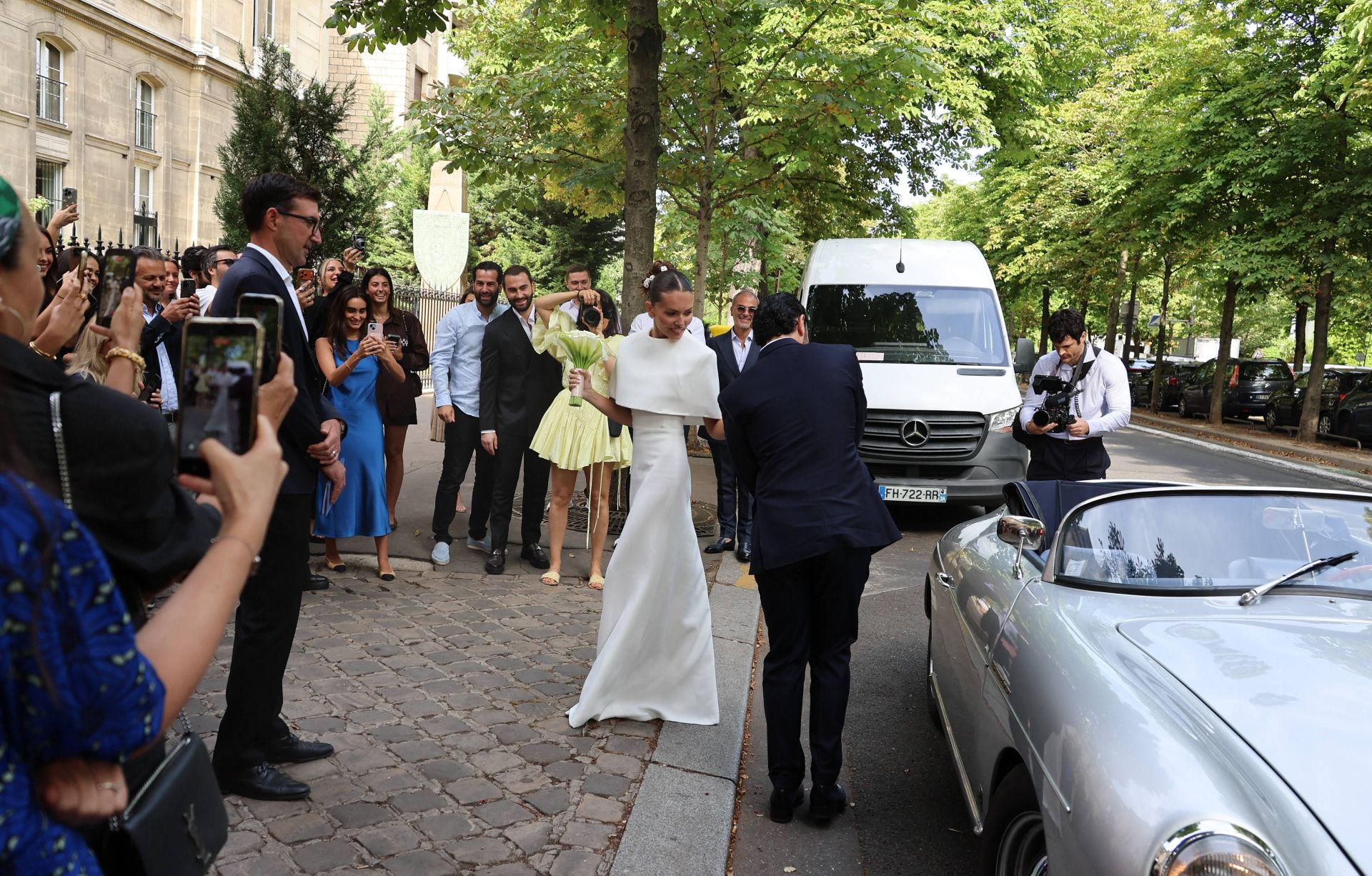 Thylane Blondeau and Benjamin Attal posing together on their wedding day in Paris
