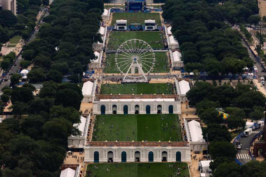 Aerial view of the 110-foot Freedom 250 Ferris wheel and surrounding fairgrounds on the National Mall in Washington, DC