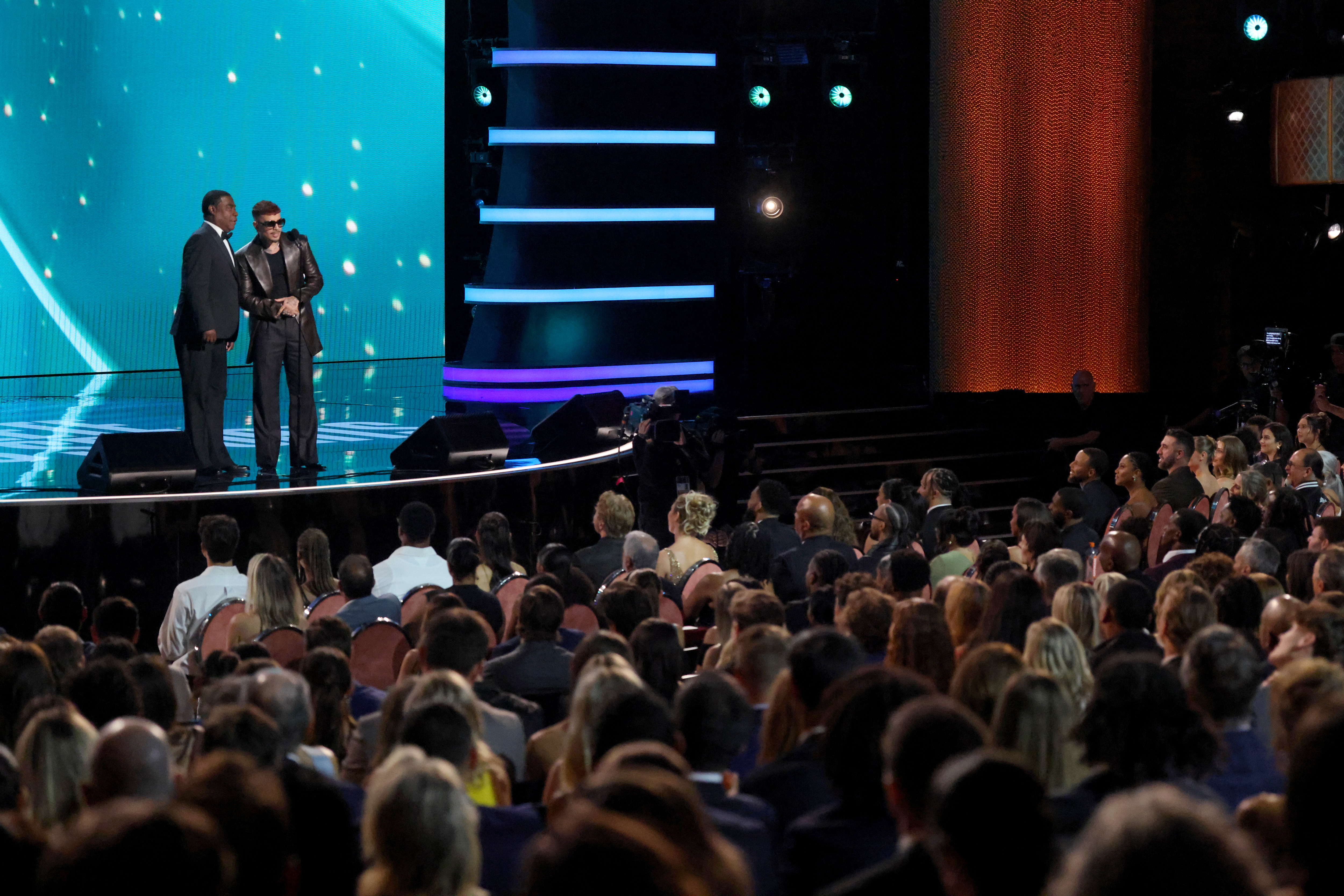 Tracy Morgan and Rauw Alejandro speaking onstage at the 2026 ESPY Awards at Lincoln Center in New York City