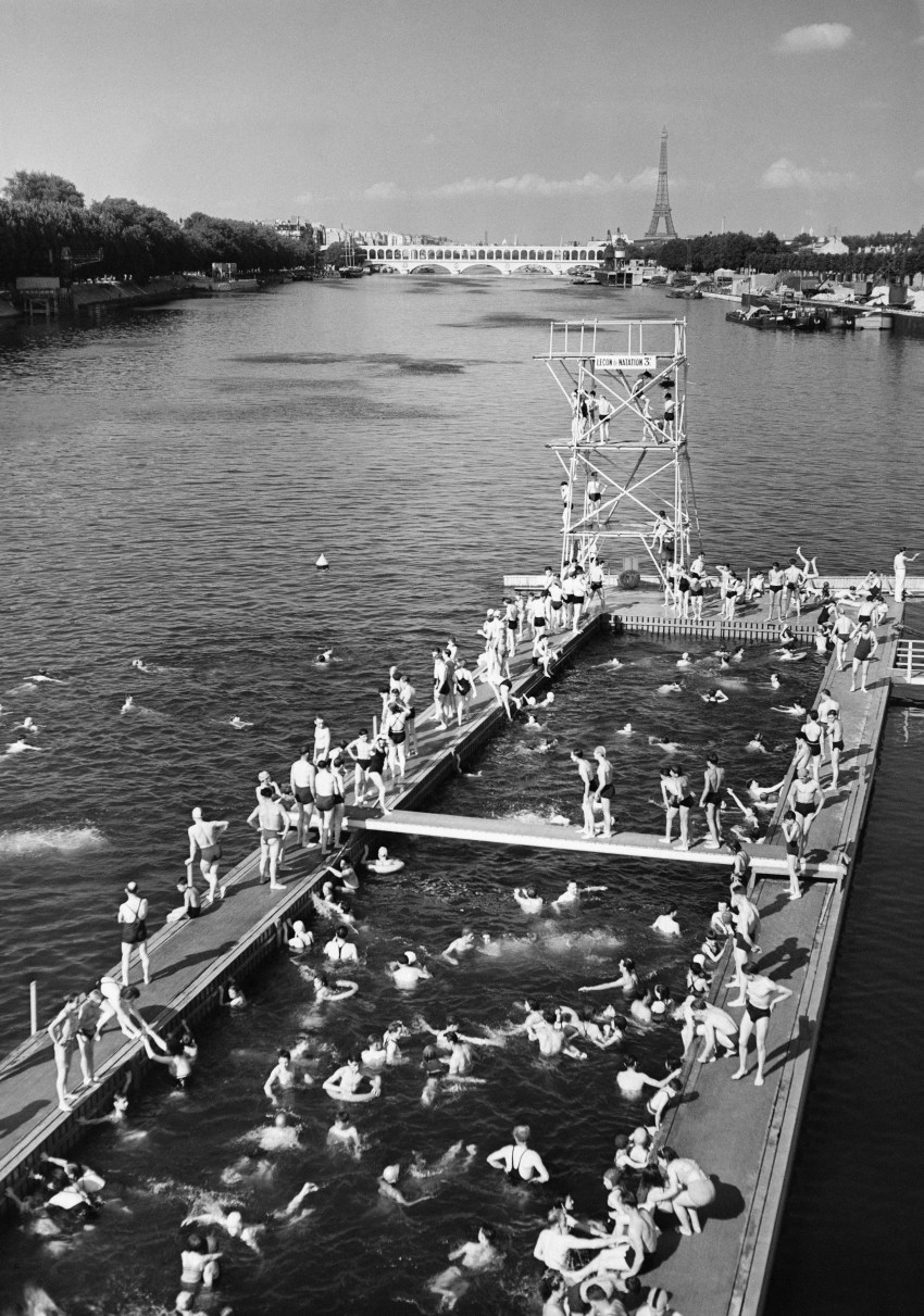 People swimming in an outdoor pool on the Seine river near the Auteuil viaduct in Paris, 1938