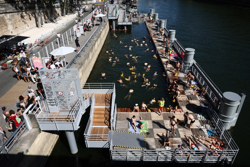 Swimmers in the Seine river at the Bras Marie bathing site in Paris