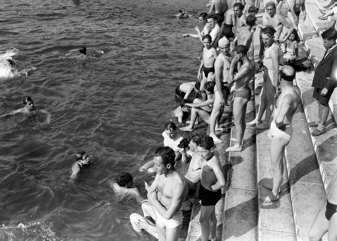 People swimming in the Seine river near the Pont d'Iéna in Paris during a heat wave in June 1946