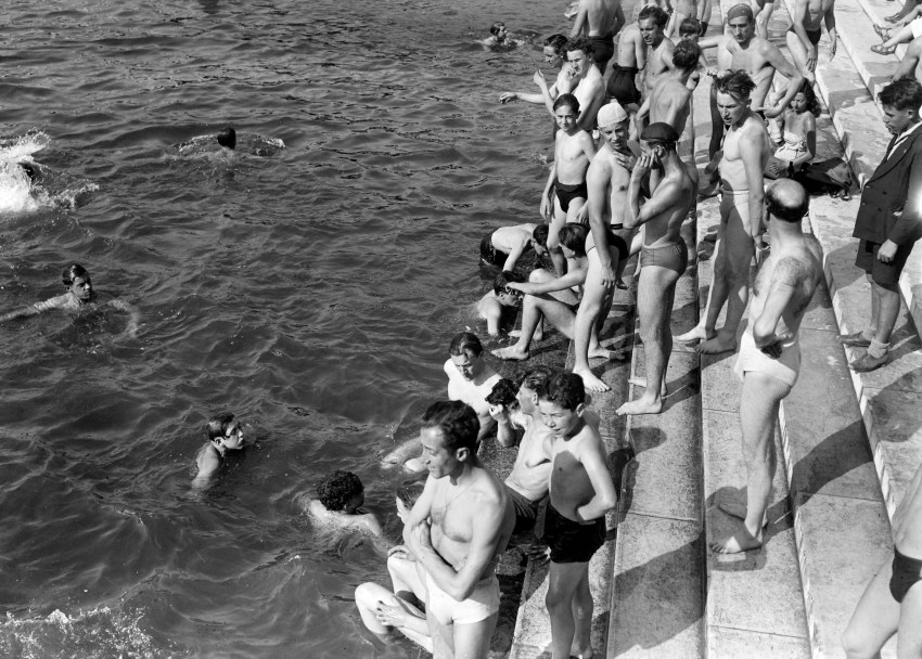 People swimming in the Seine river near the Pont d'Iéna in Paris during a heat wave in June 1946