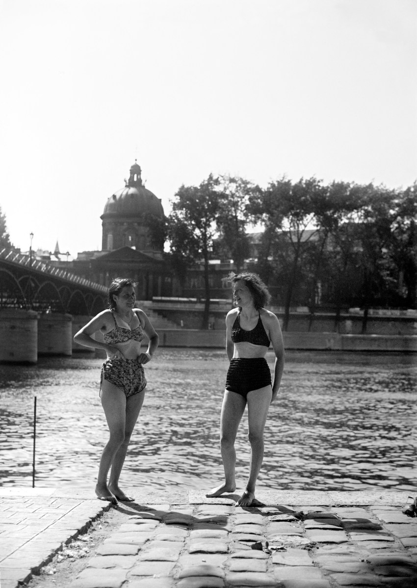 Two young women sunbathing on the right bank of the Seine River in Paris in summer 1945