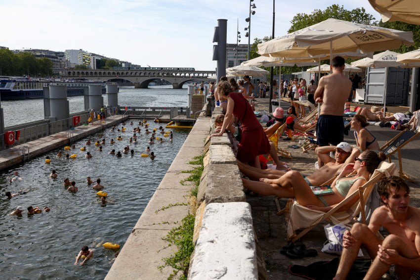 People swimming in the River Seine at the Bercy public swimming site in Paris
