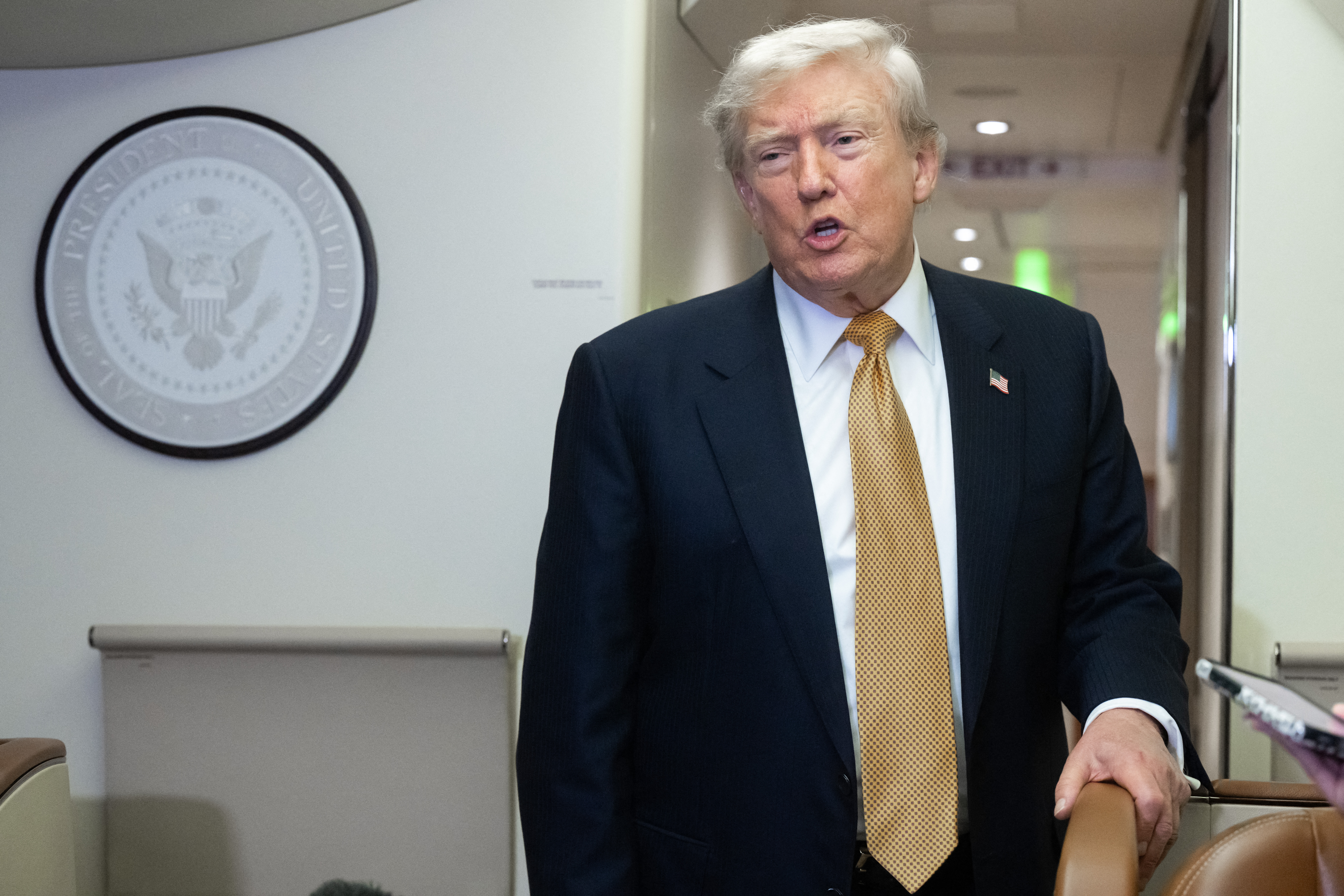 President Donald Trump speaking with media aboard Air Force One on July 8, 2026