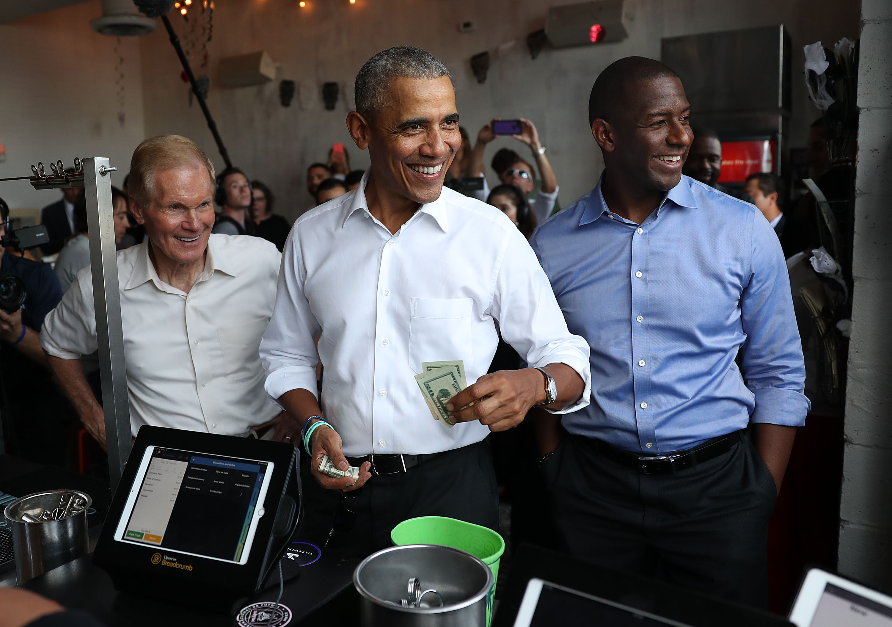 Barack Obama, Andrew Gillum, and Bill Nelson eating lunch together at Coyo Taco restaurant in Miami, Florida