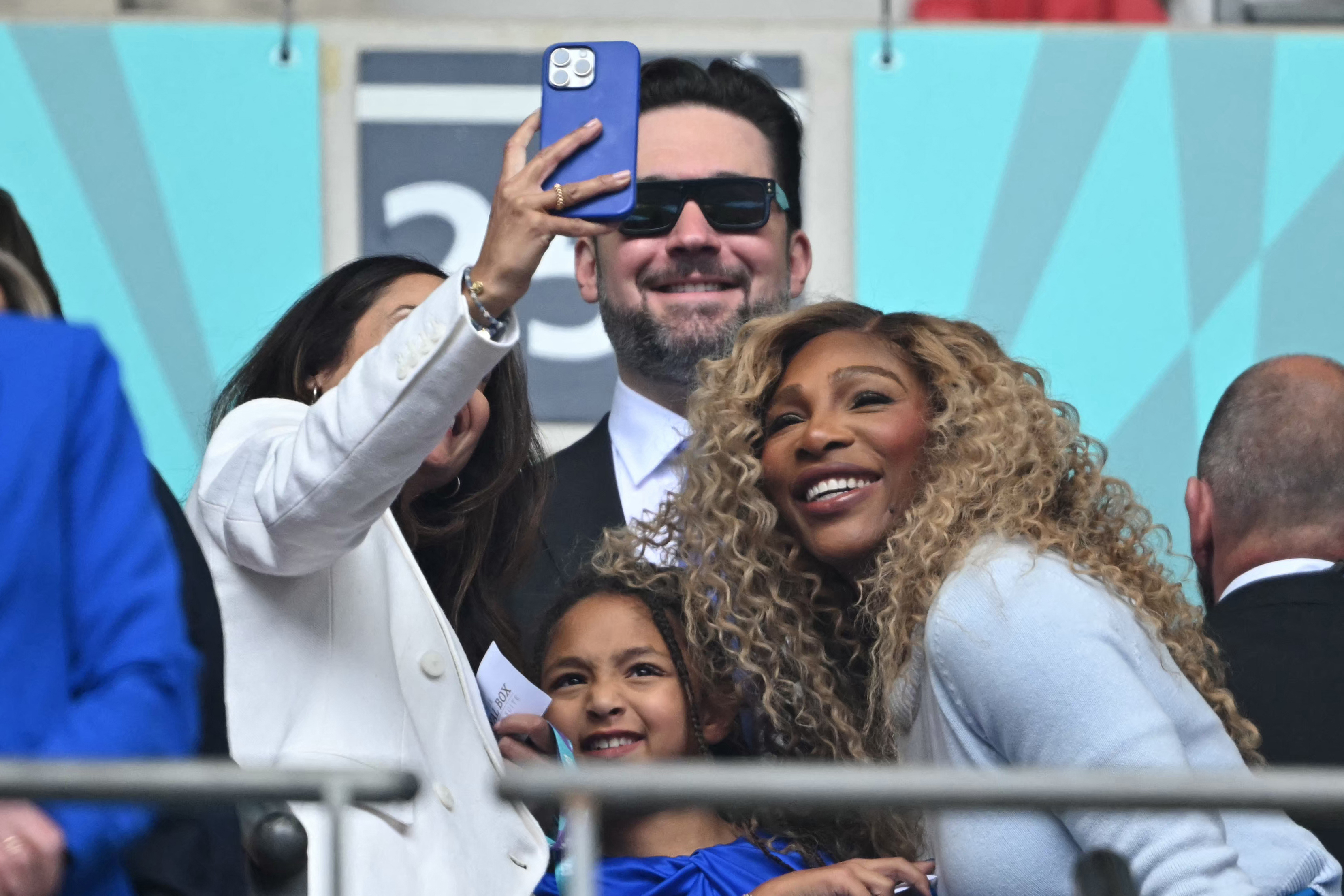 Serena Williams posing for a selfie with her daughter Olympia and husband Alexis Ohanian at Wembley Stadium