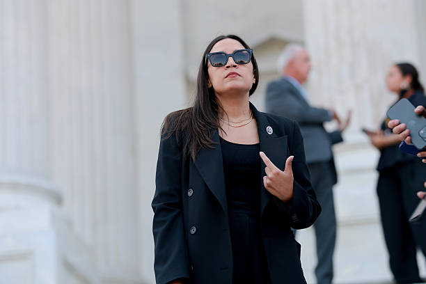 Alexandria Ocasio-Cortez speaking to reporters on the steps of the U.S. Capitol in Washington, DC