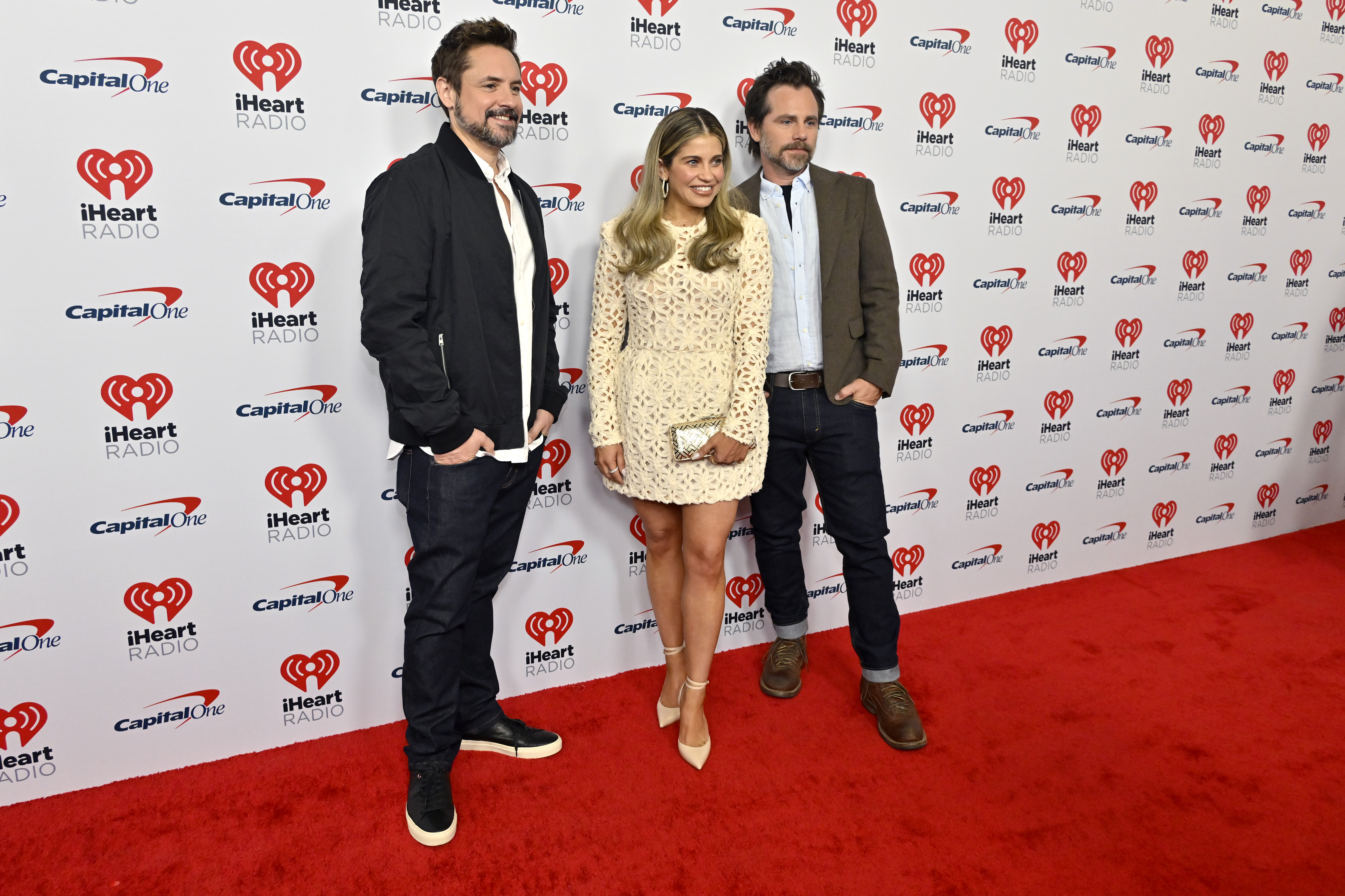 Will Friedle, Danielle Fishel, and Rider Strong posing together at the 2023 iHeartRadio Music Festival in Las Vegas