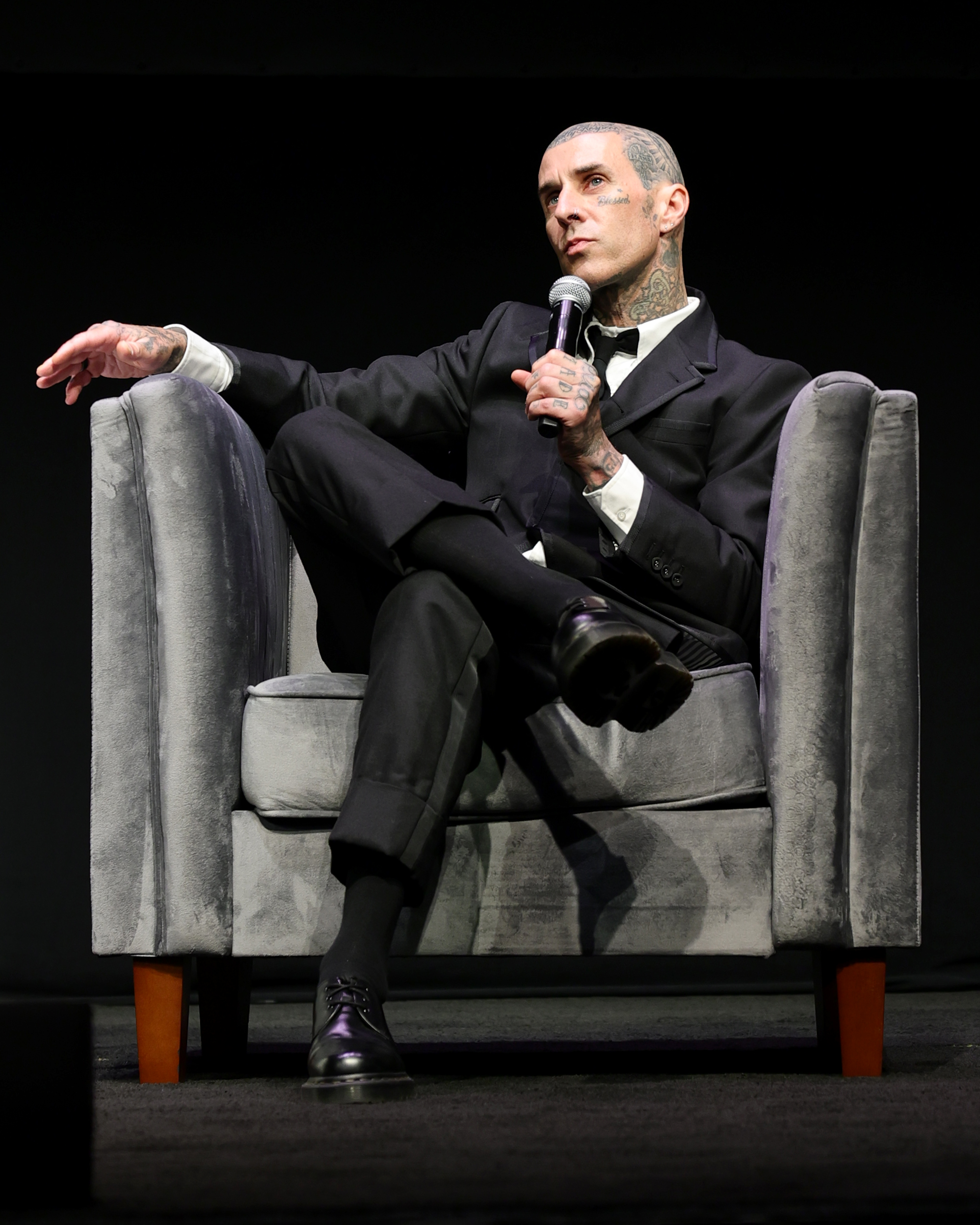Travis Barker speaking onstage at the Tribeca Festival premiere of Travis Barker: Louder Than Fear