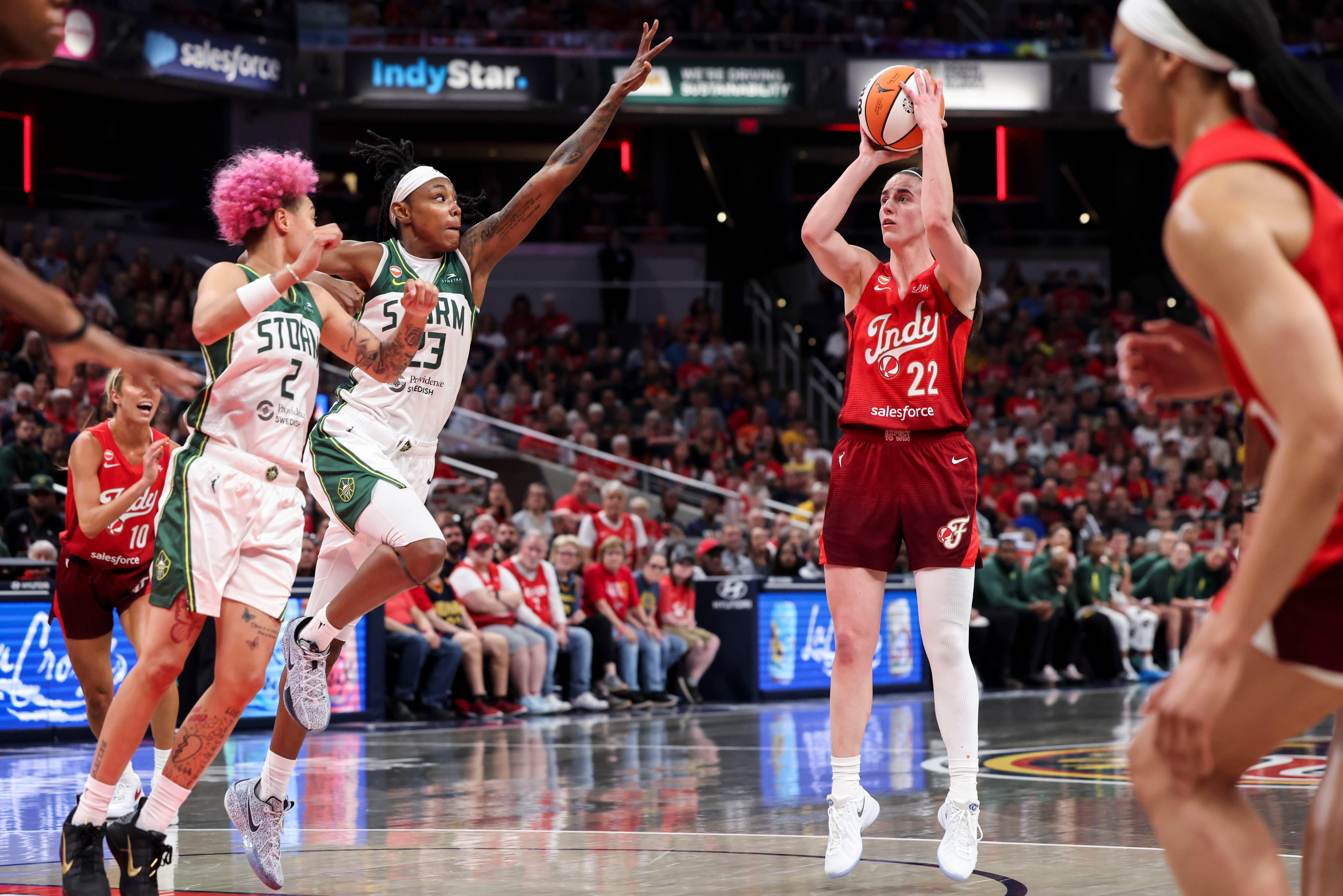 Caitlin Clark (22) of the Indiana Fever attempting a basket at Gainbridge Fieldhouse in Indianapolis