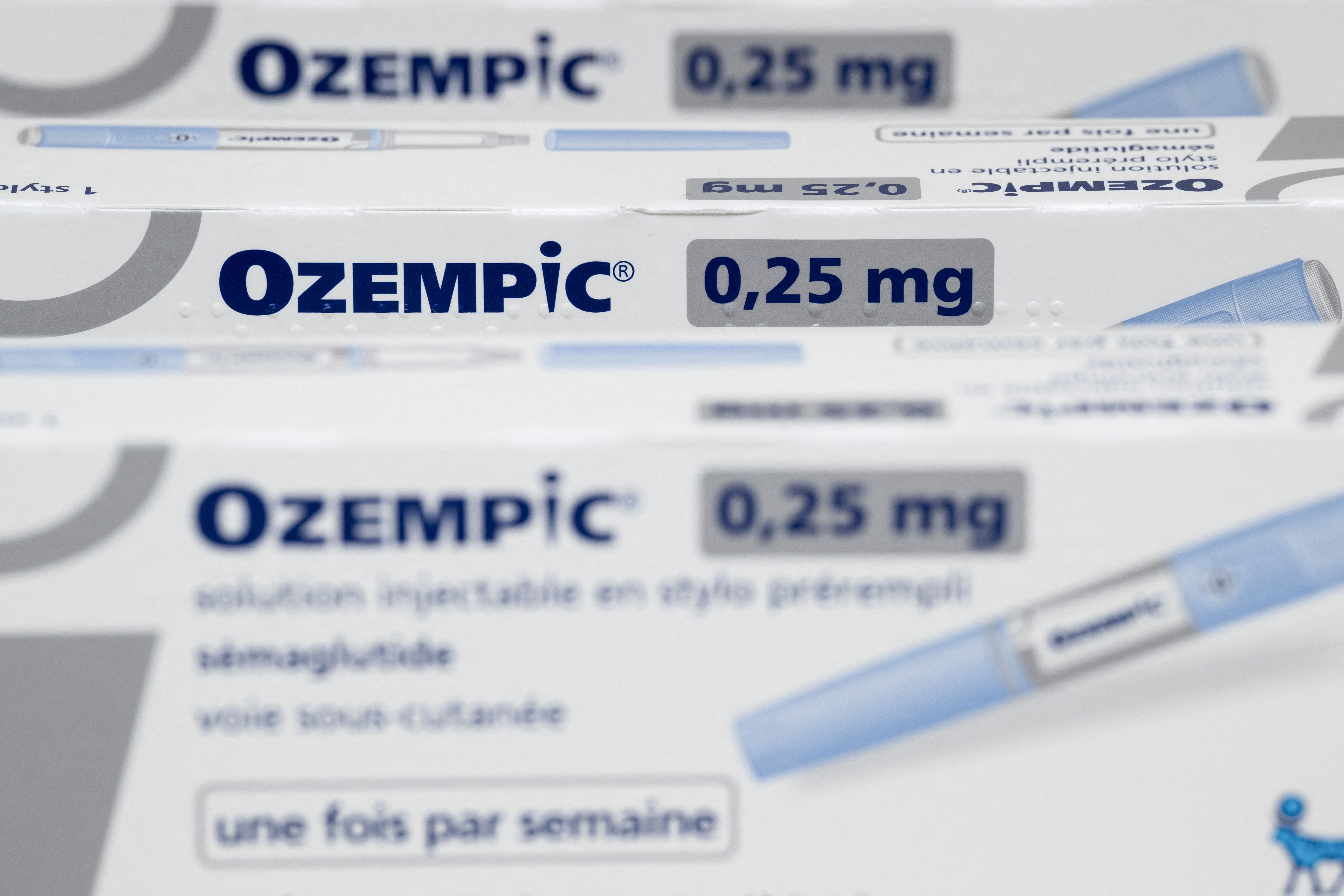 Close-up of multiple Ozempic 0.25 mg medication boxes with an injectable pen visible on the side.