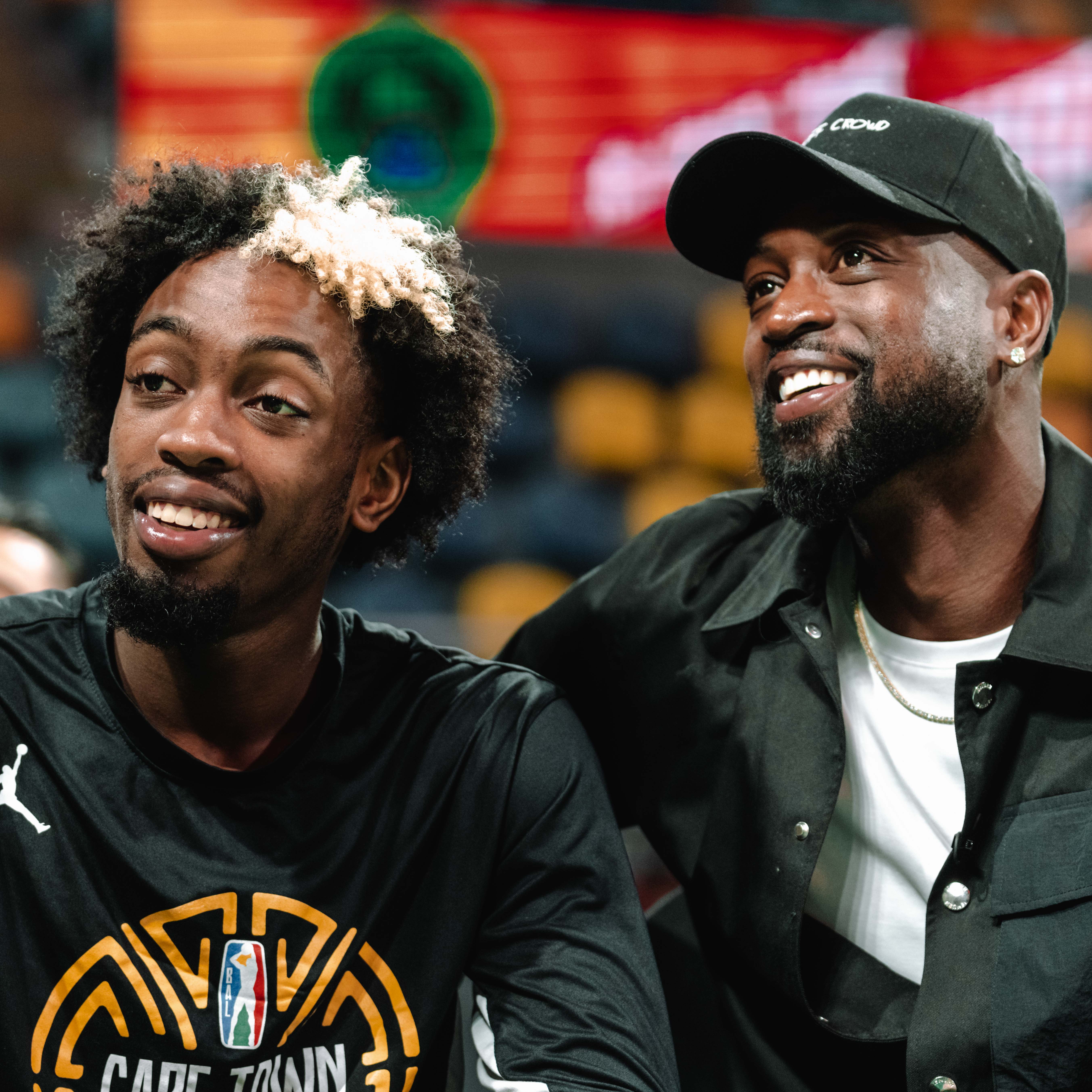 Click to open the image gallery Zaire Wade and Dwyane Wade standing together courtside before a Basketball Africa League game in Cairo, Egypt