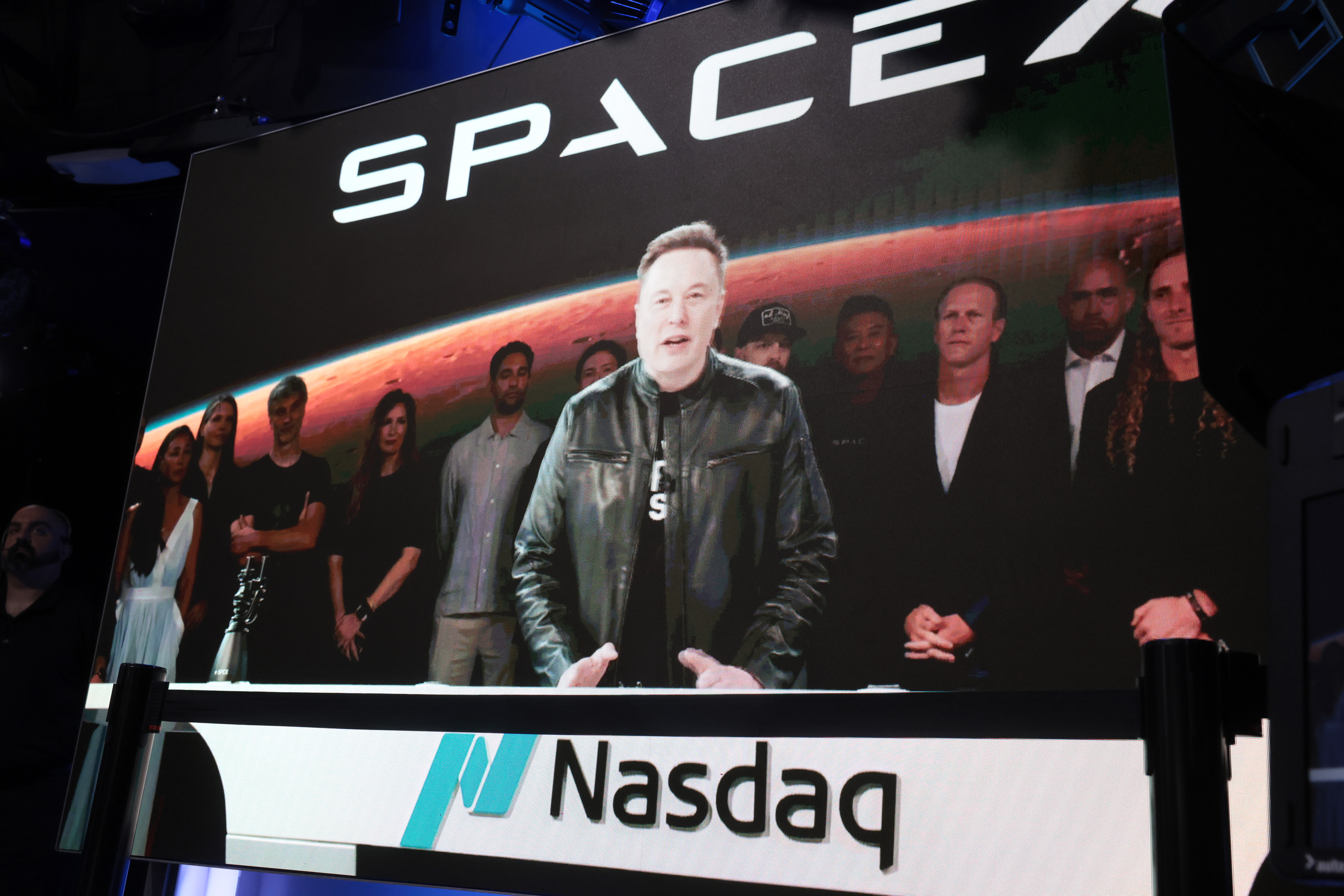 Click to open the image gallery Elon Musk speaking via video screen at the Nasdaq Marketsite in Times Square during SpaceX's IPO launch