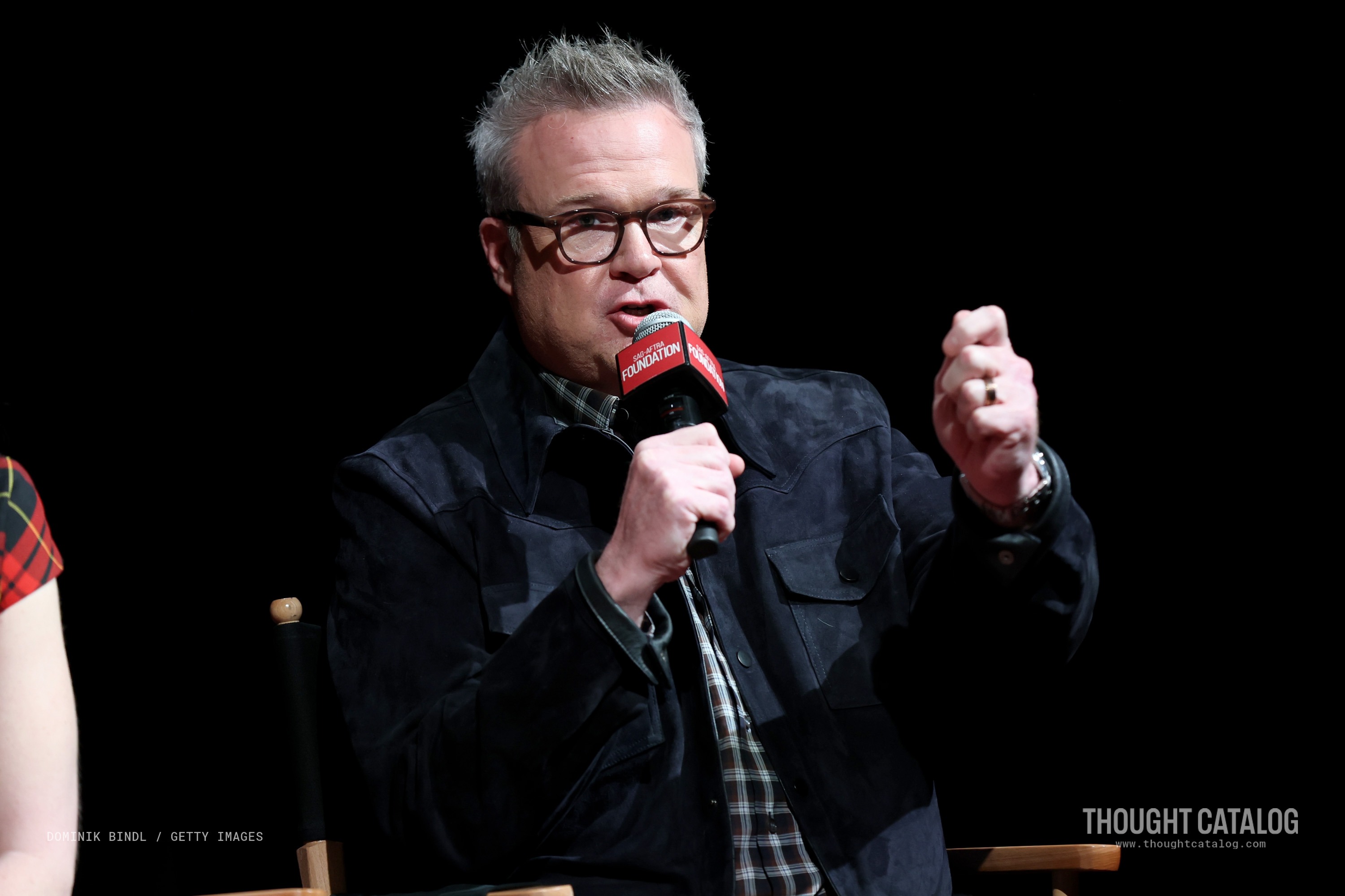 Eric Stonestreet smiling at a public event