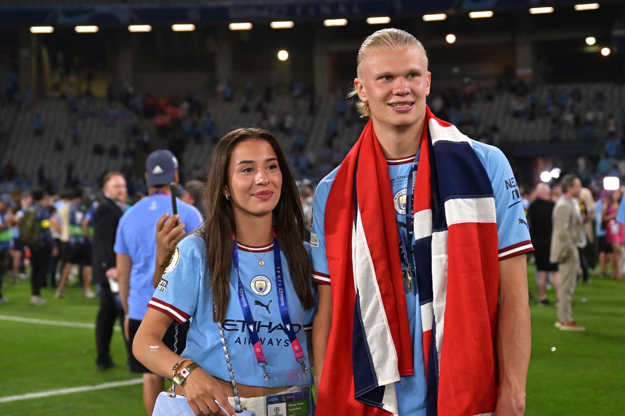 Erling Haaland and Isabel Haugseng Johansen posing together after Manchester City's Champions League final win in Istanbul