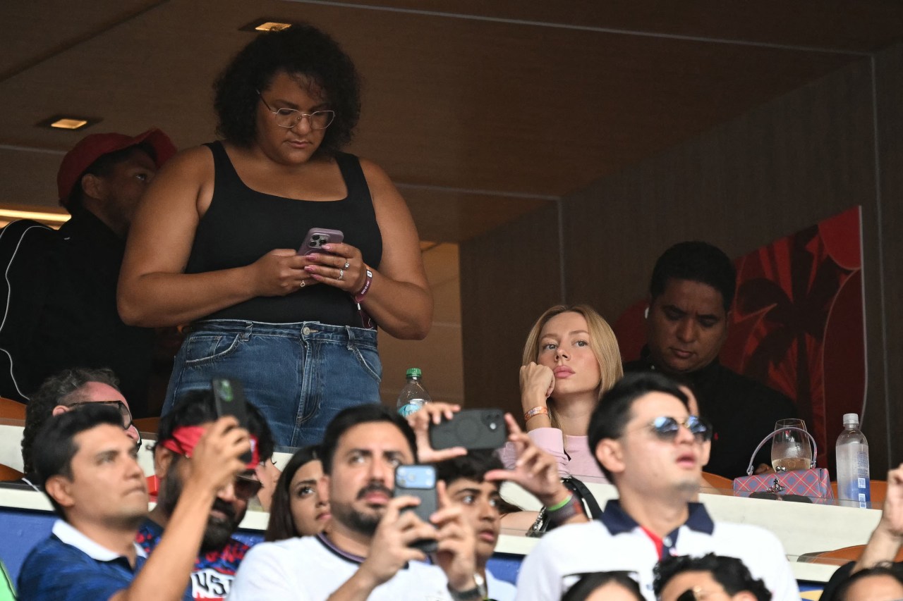 Ester Exposito seated in the stands at Miami Stadium during the 2026 World Cup third-place match between France and England