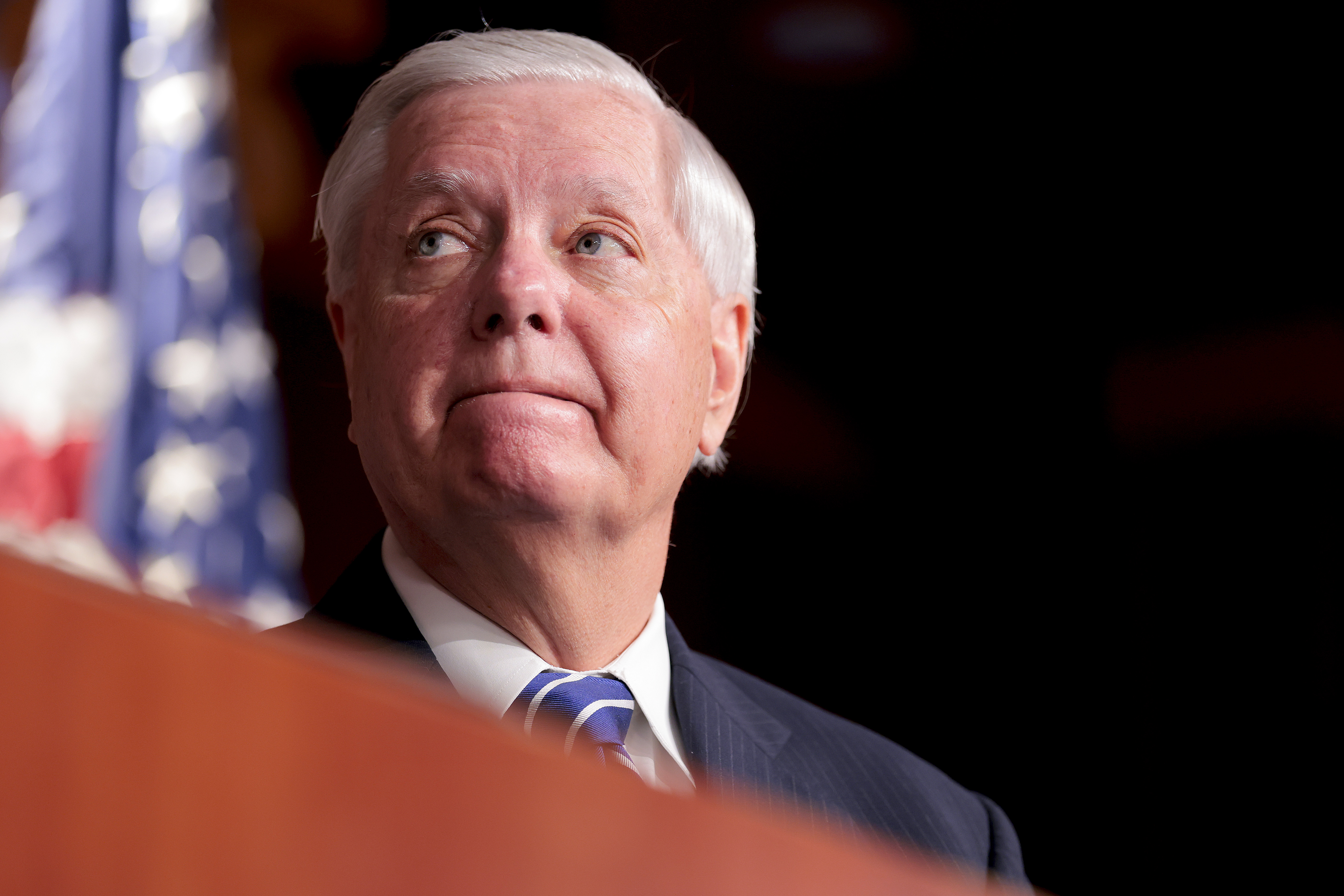 Sen. Lindsey Graham looking on during a press conference at the U.S. Capitol