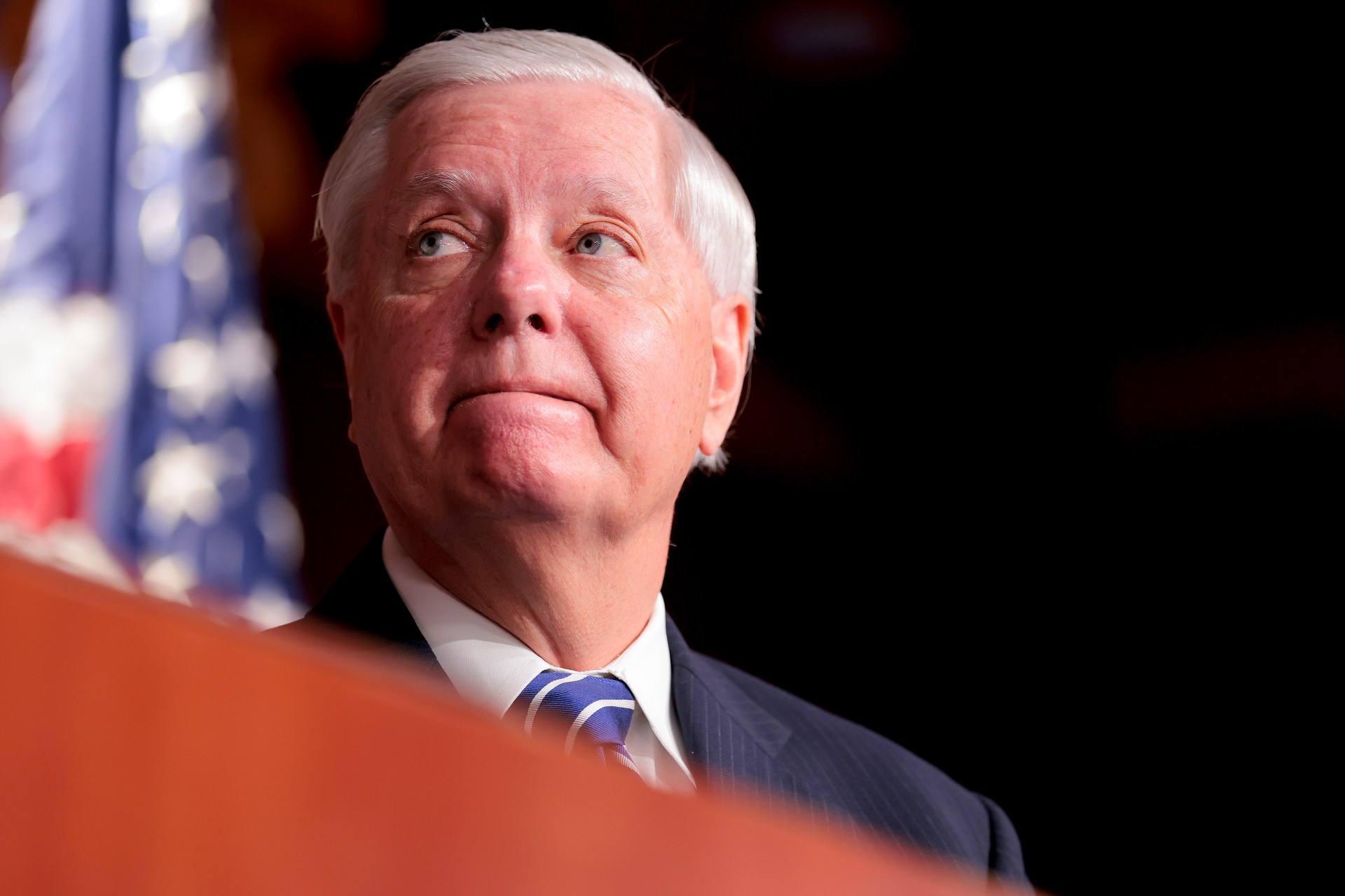 Sen. Lindsey Graham looking on during a press conference at the U.S. Capitol