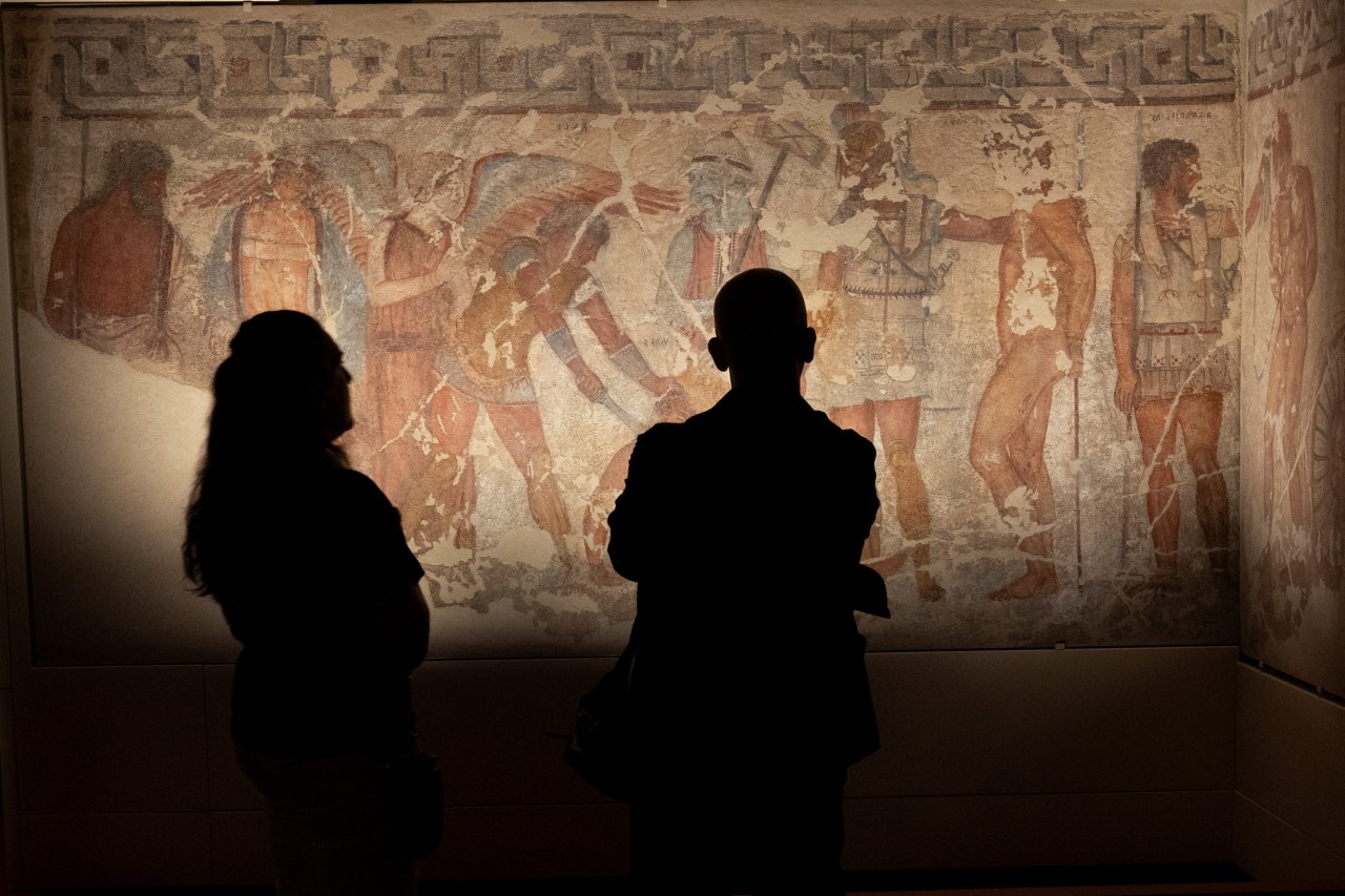Etruscan tomb frescoes on display in Rome, featuring ancient painted panels acquired by Italy