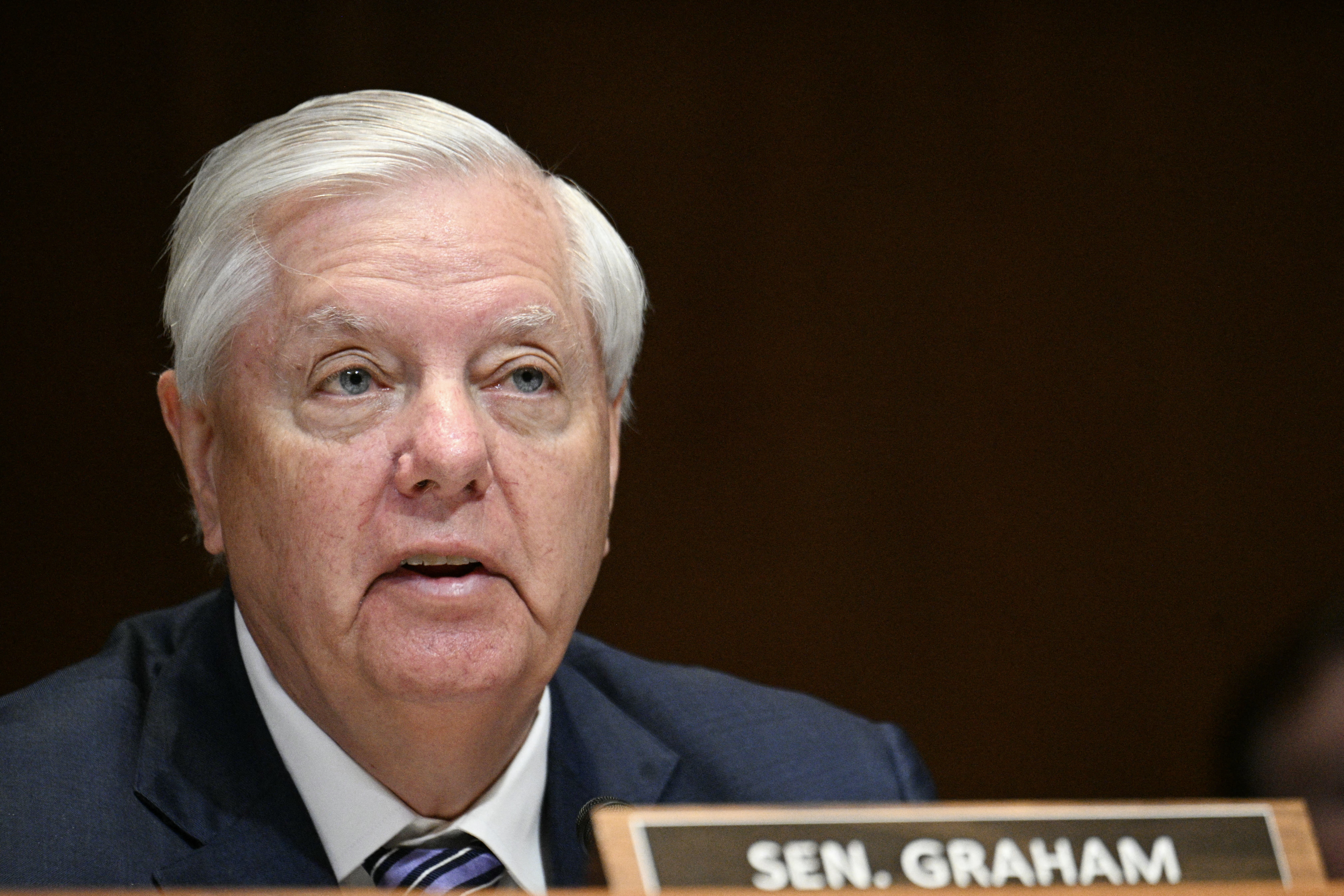 Sen. Lindsey Graham questioning Defense Secretary Pete Hegseth and Gen. Dan Caine at a Senate defense budget hearing on Capitol Hill