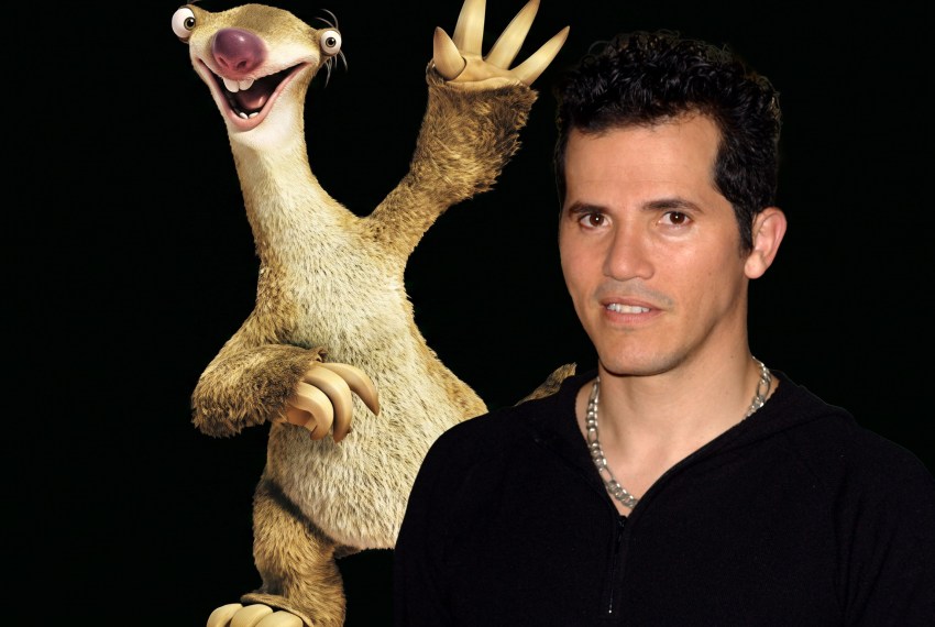 John Leguizamo in a black zip-up hoodie and silver chain necklace, posing at a photo call in Madrid, Spain.