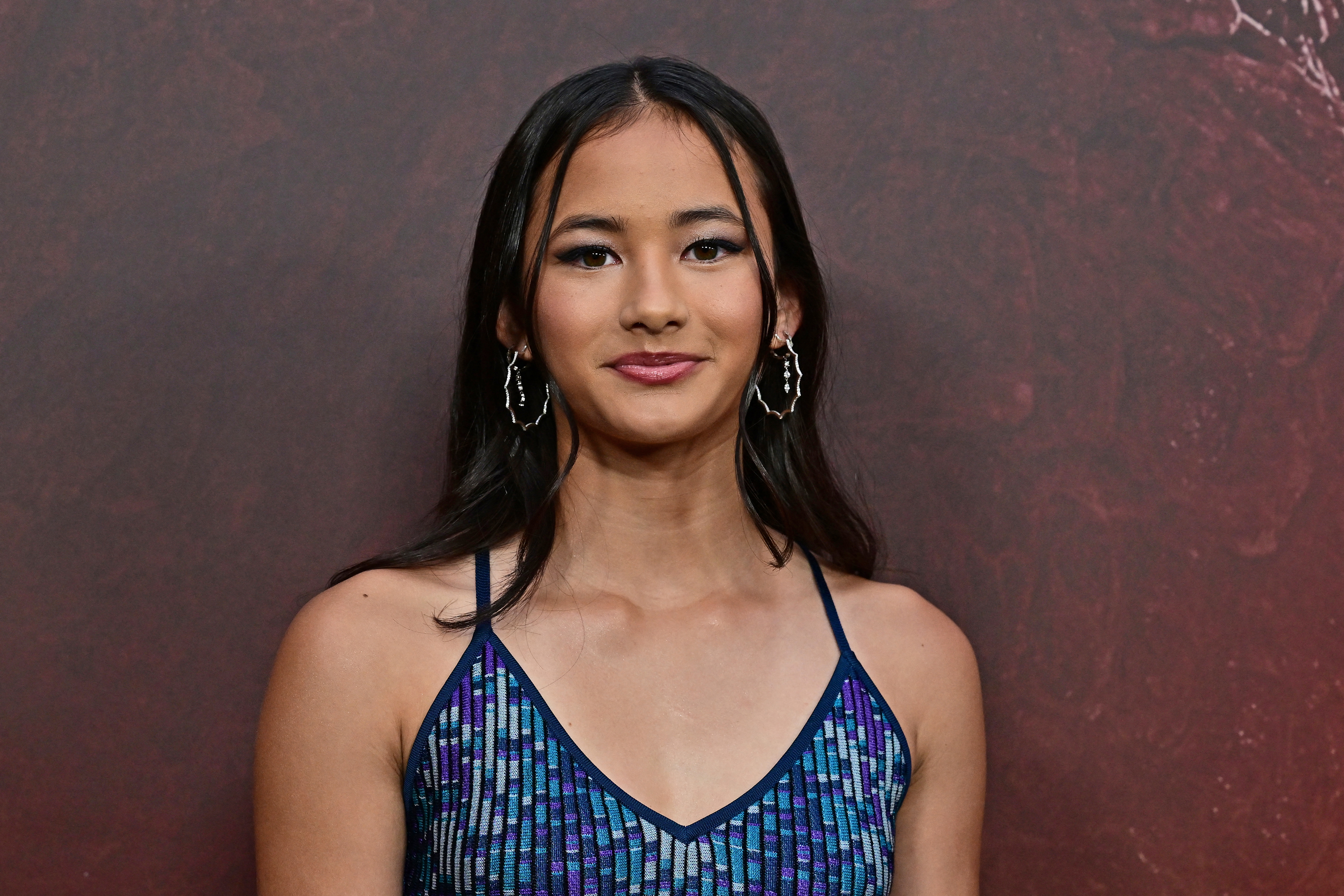 Kaylee Hottle posing on the red carpet at the TCL Chinese Theater in Hollywood