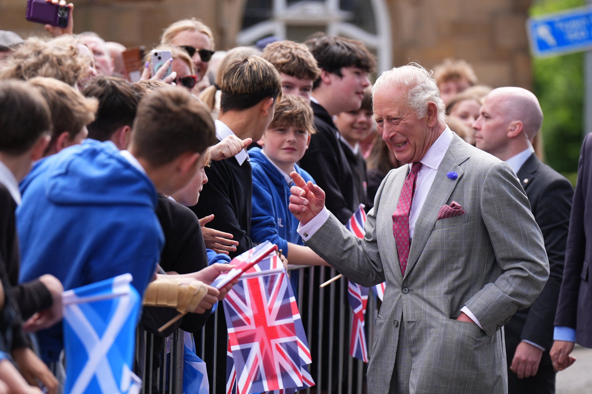 King Charles III shaking hands with members of the public in Jedburgh, Scotland