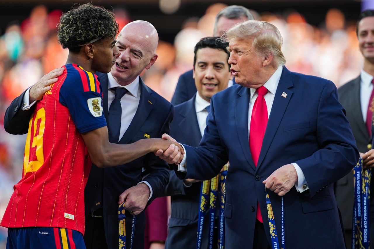 Lamine Yamal receiving his Winners Medal from Donald Trump and FIFA President Gianni Infantino after the 2026 FIFA World Cup Final in East Rutherford, New Jersey