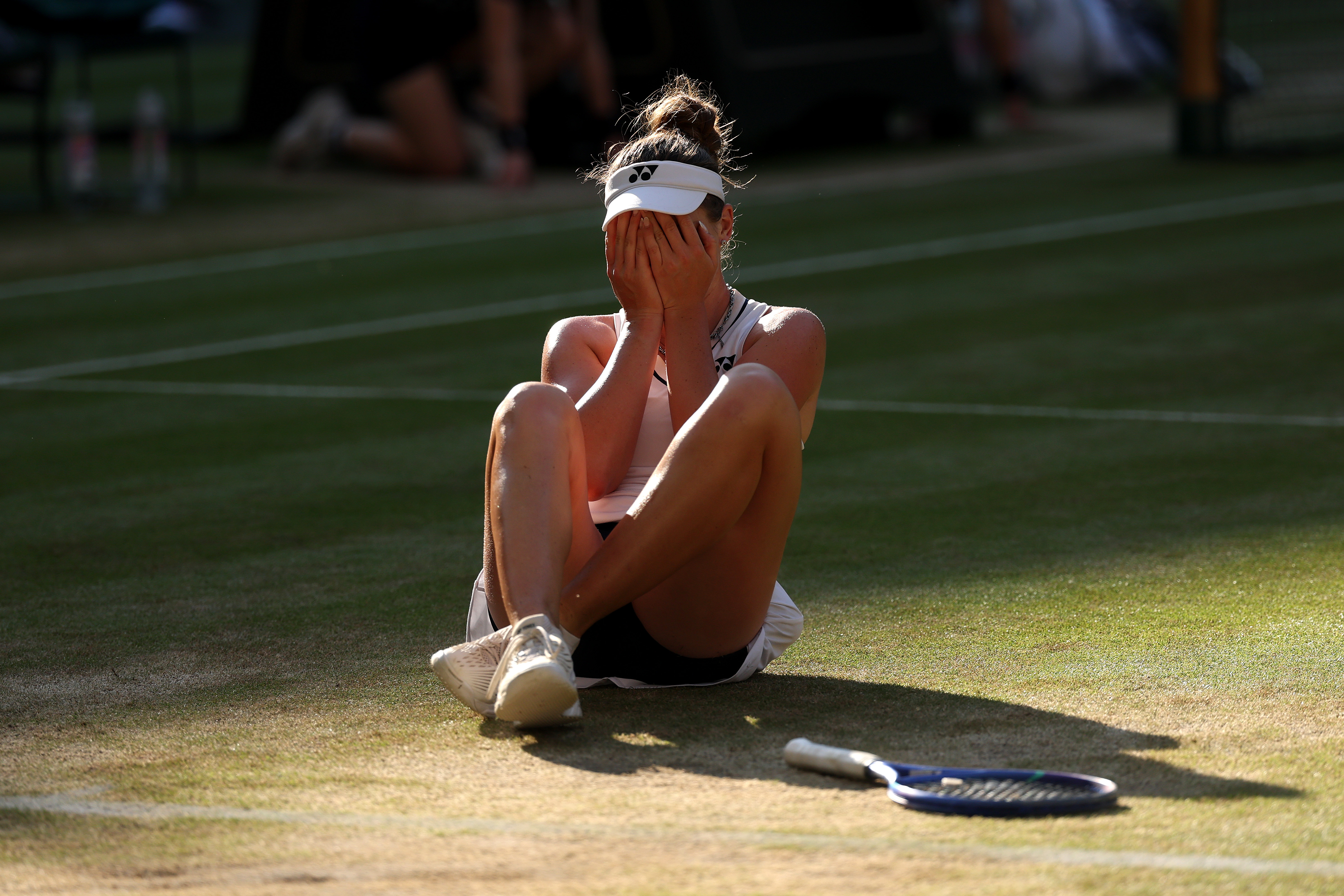 Linda Nosková celebrating winning championship point against Karolína Muchová in the Wimbledon 2026 Ladies' Singles final