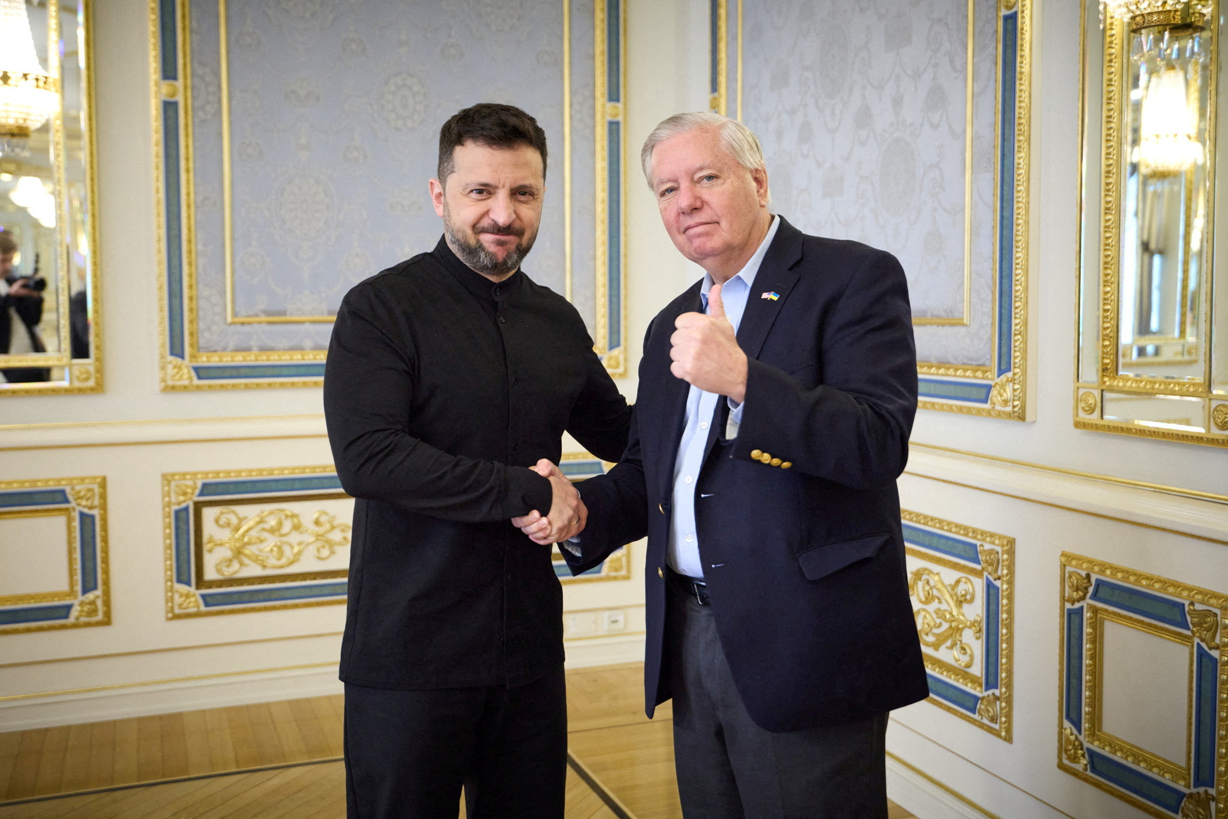 Senator Lindsey Graham shaking hands with President Volodymyr Zelenskyy in Kyiv, Ukraine