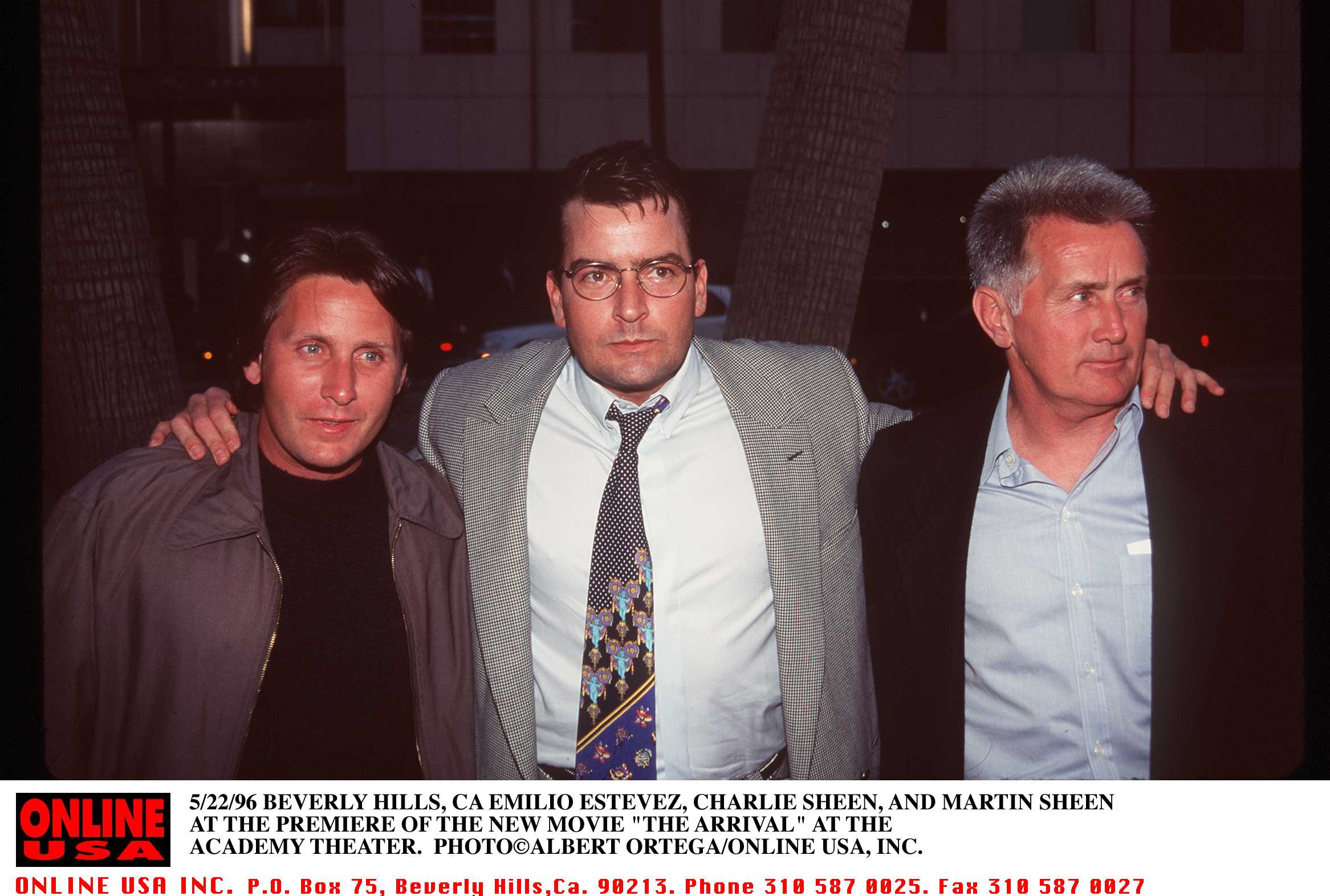 Emilio Estevez, Charlie Sheen, and Martin Sheen standing together at a movie premiere in Beverly Hills in 1996